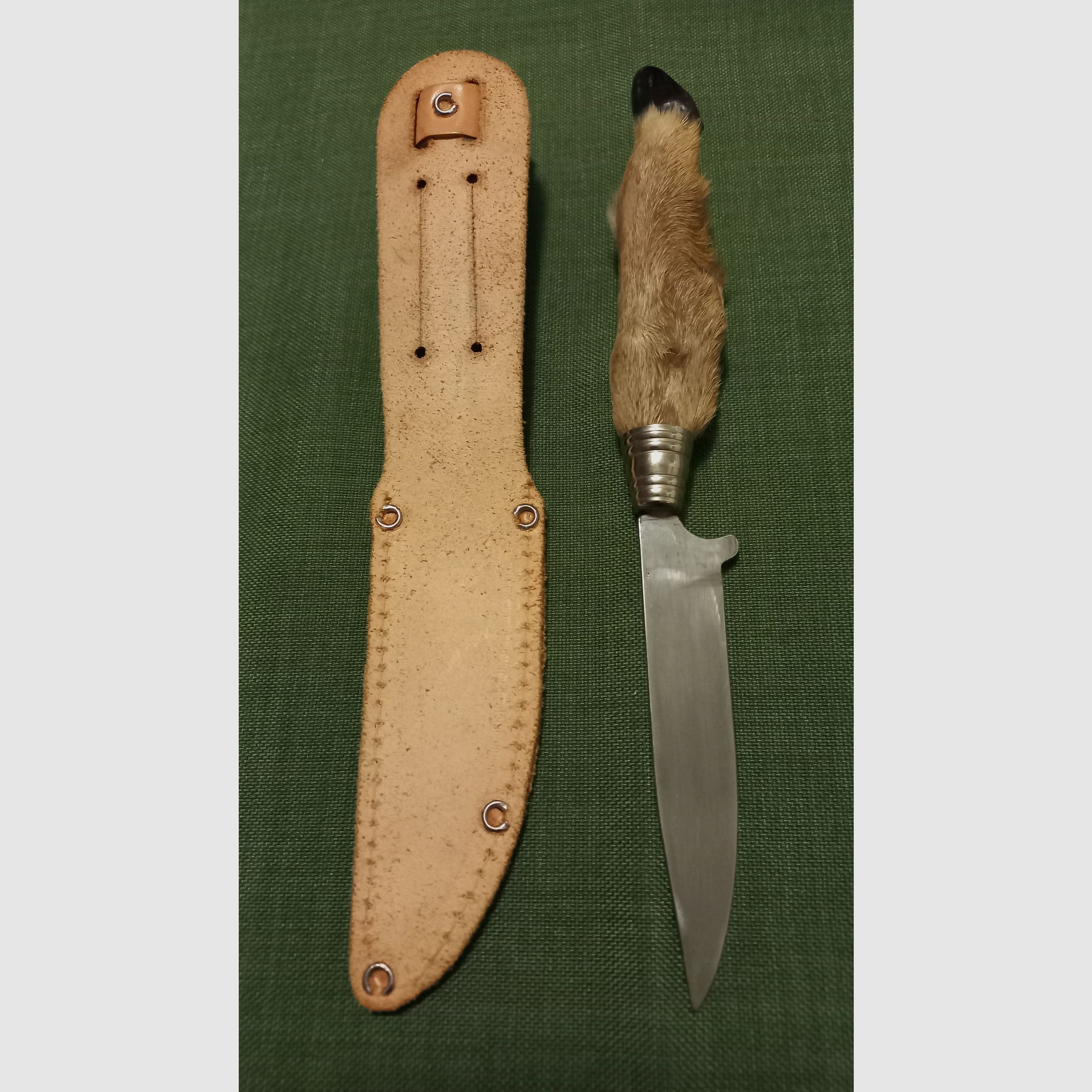 Traditional hunting knife with deer foot handle