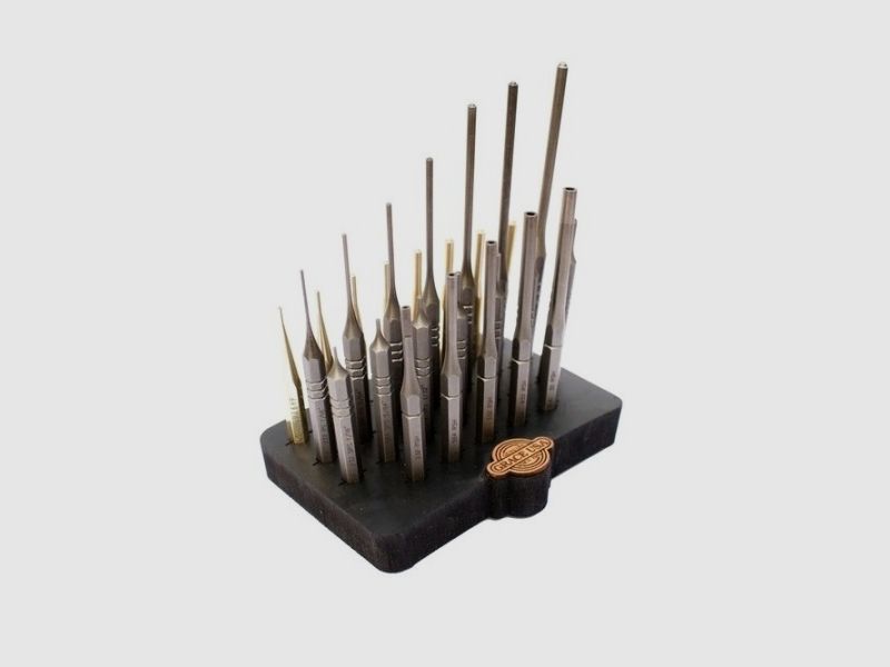 27 steel and brass pins with block