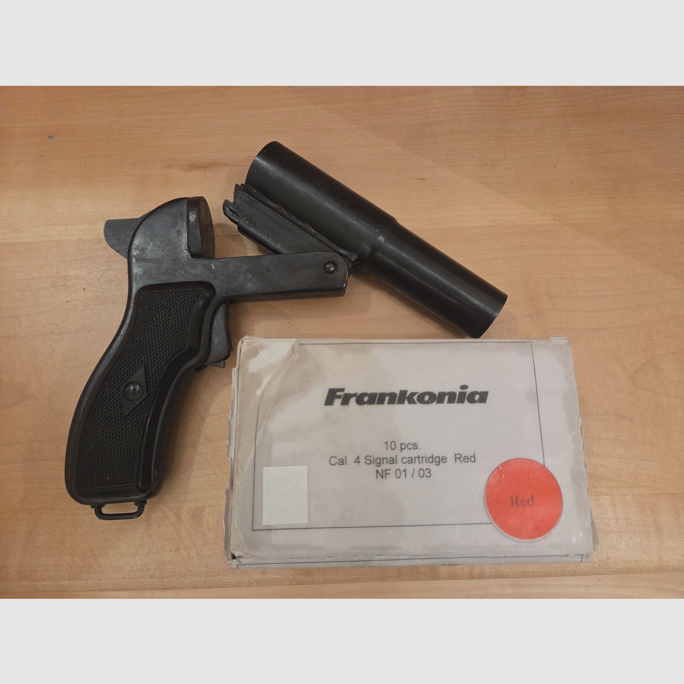 Flare gun with red signal ammunition