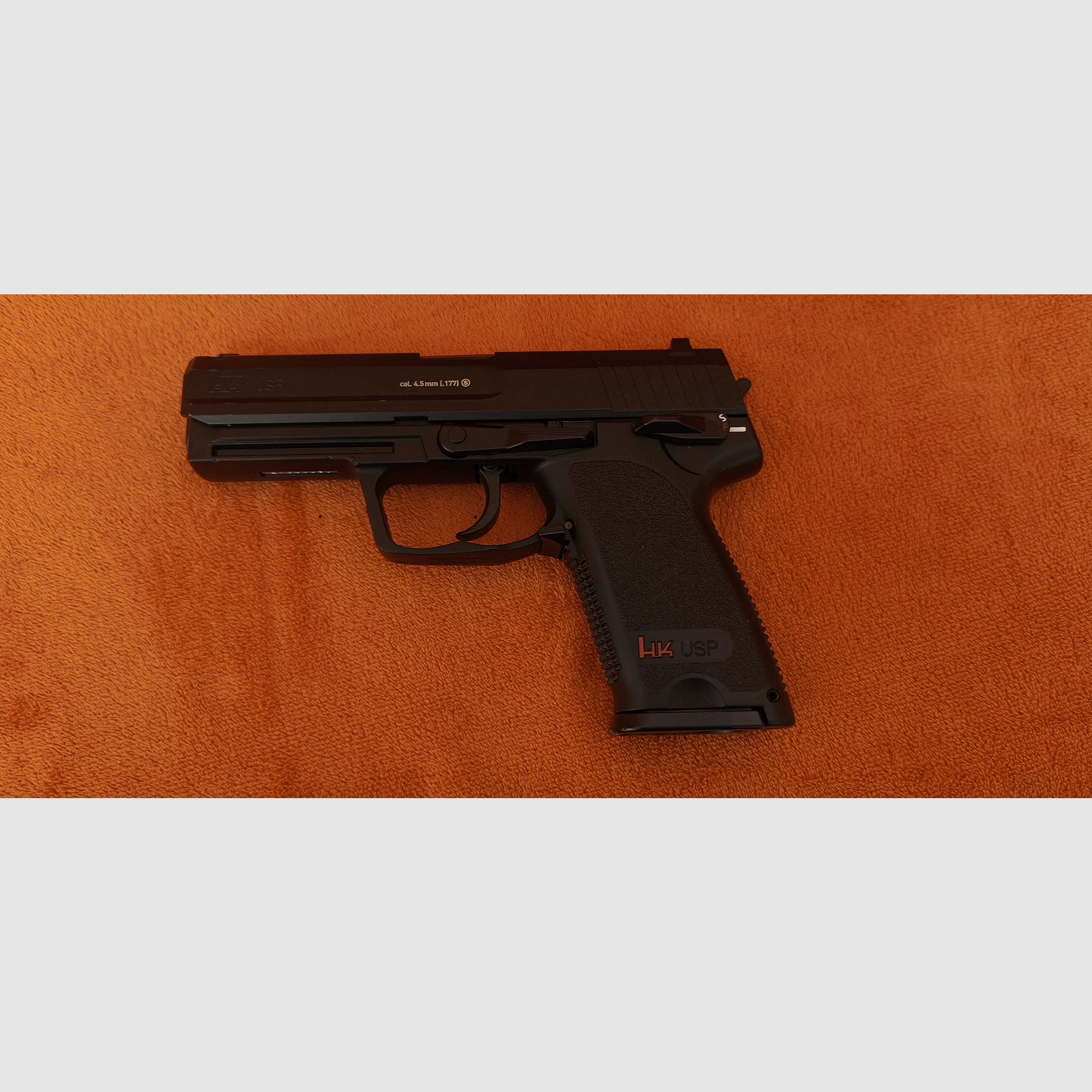 HK USP CO2 air pistol 4.5mm steel BB with signs of use