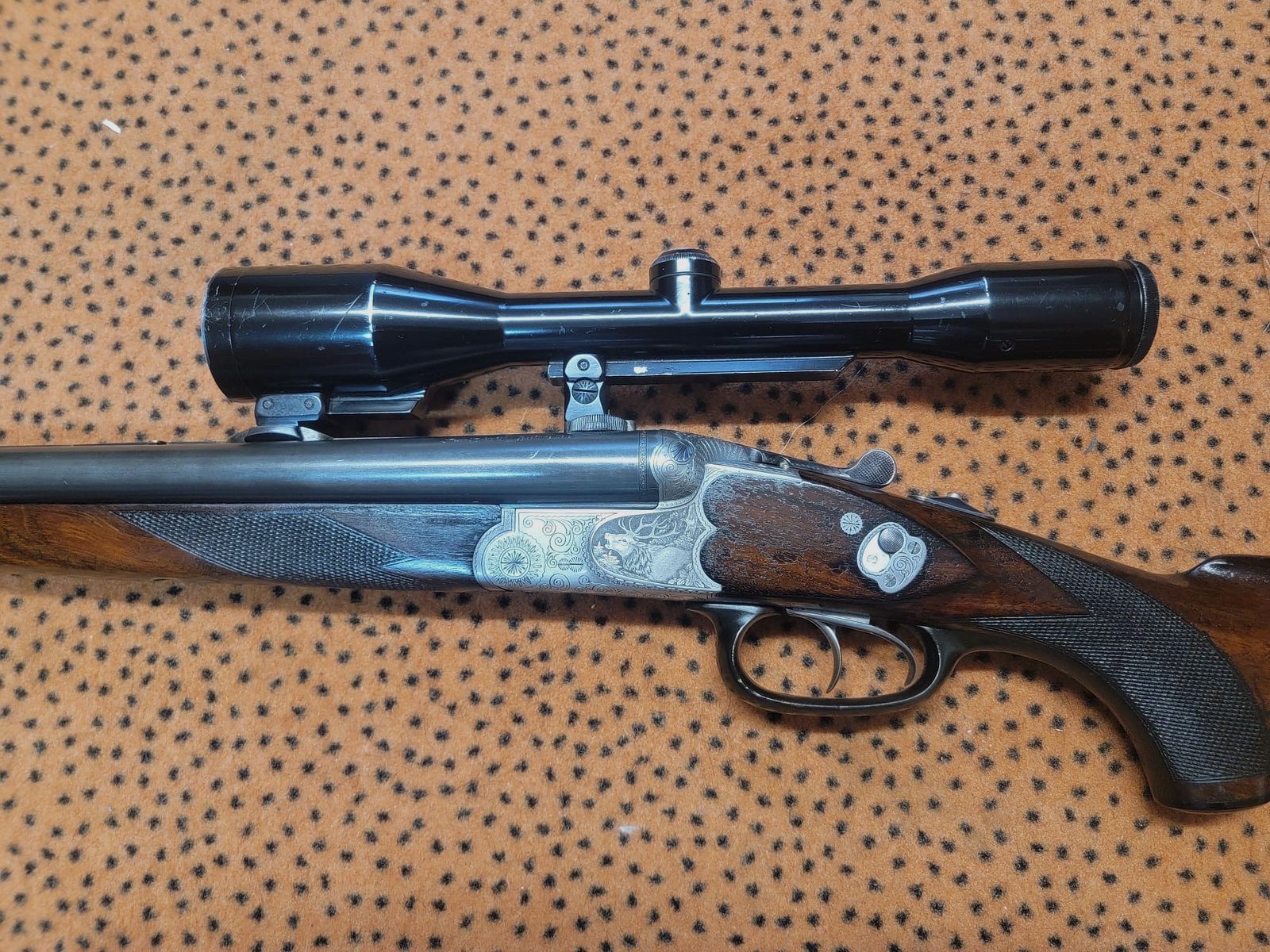 Sauer und Sohn Drilling Modello 3000 con incisione a mano