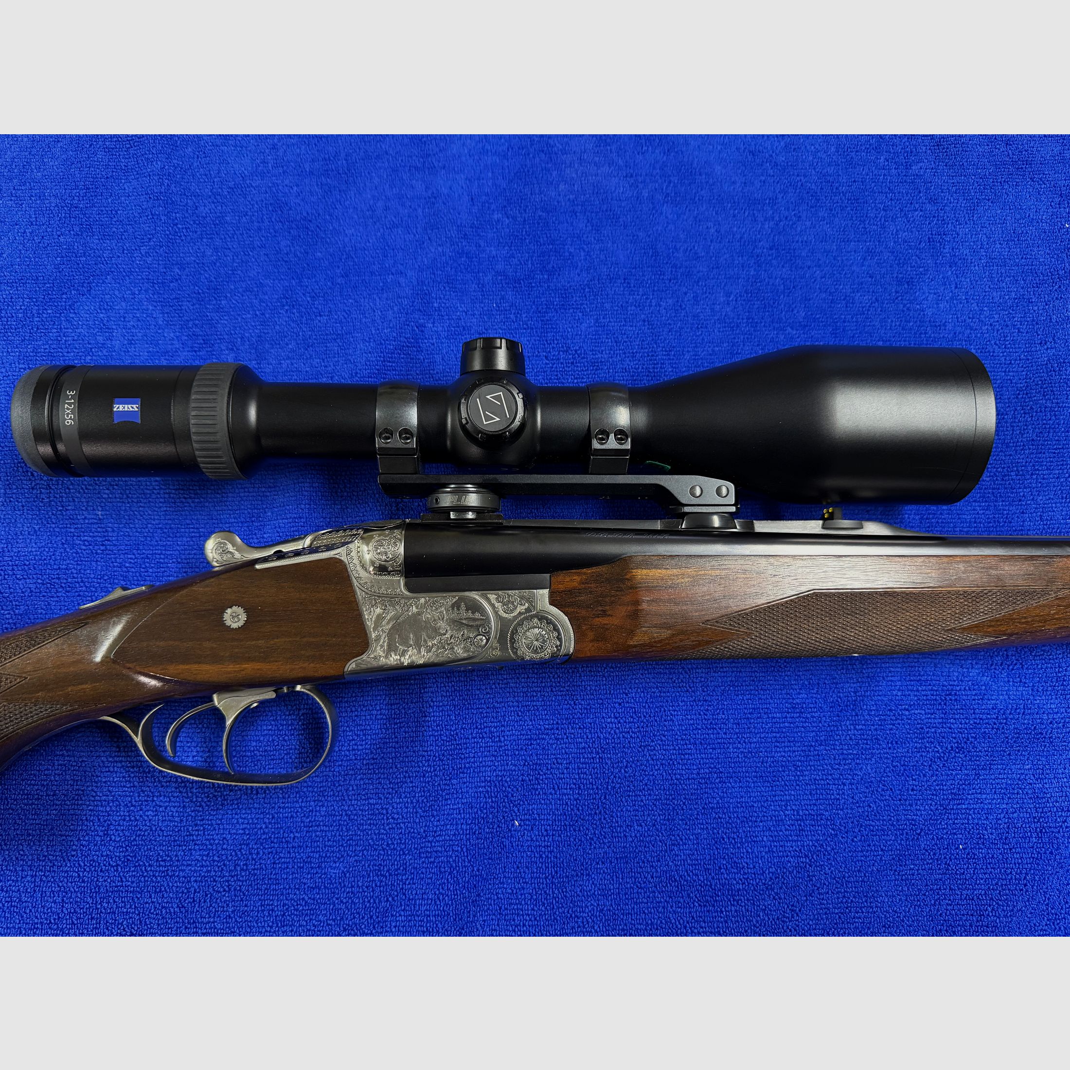 Merkel Doppelbüchsdrilling DR 961L mit ZEISS Victory HT 3-12x56