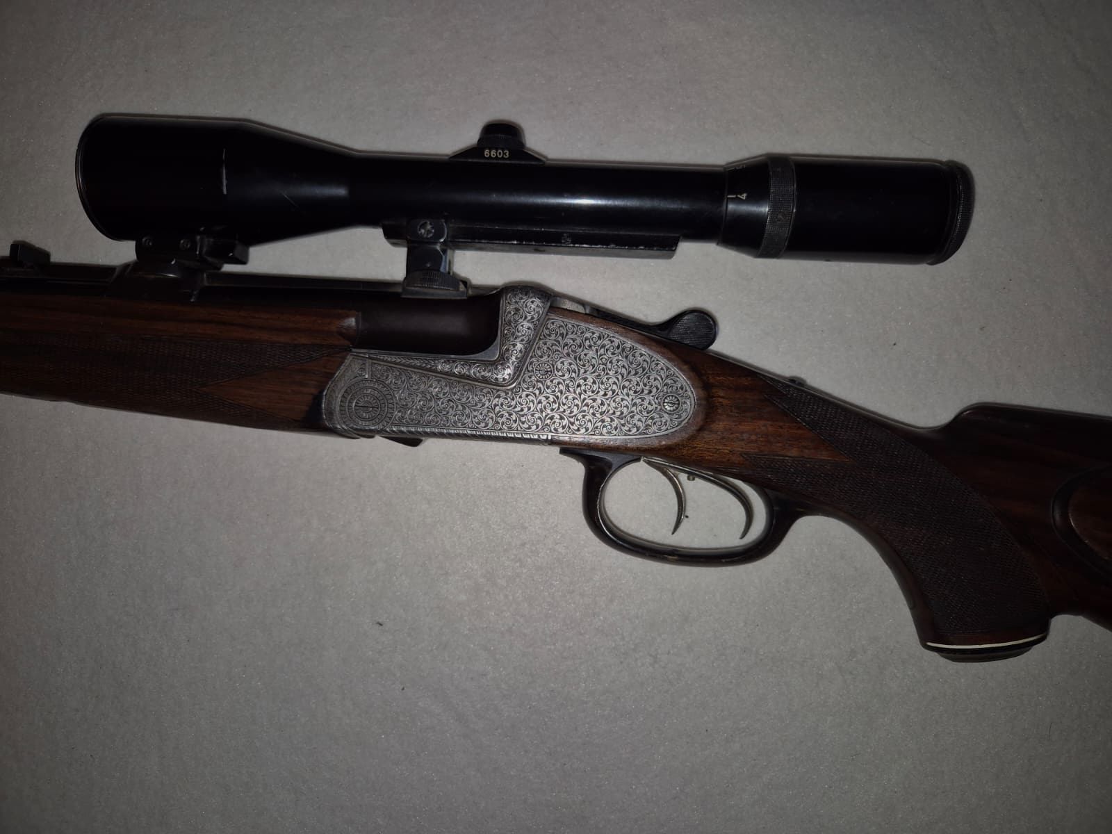 combination gun with two rifle barrels and one shotgun barrel