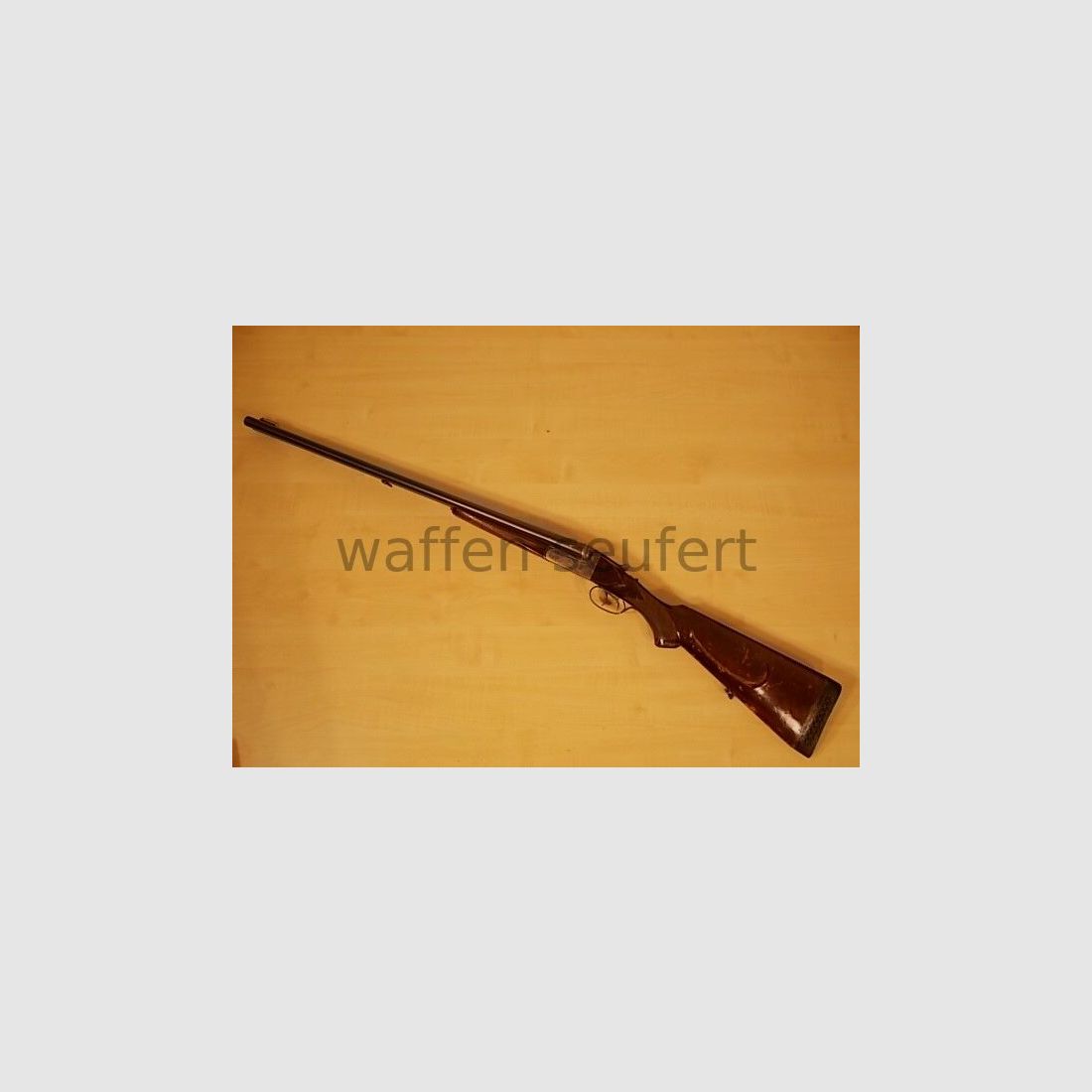 Forest double-barreled shotgun colored and engraved