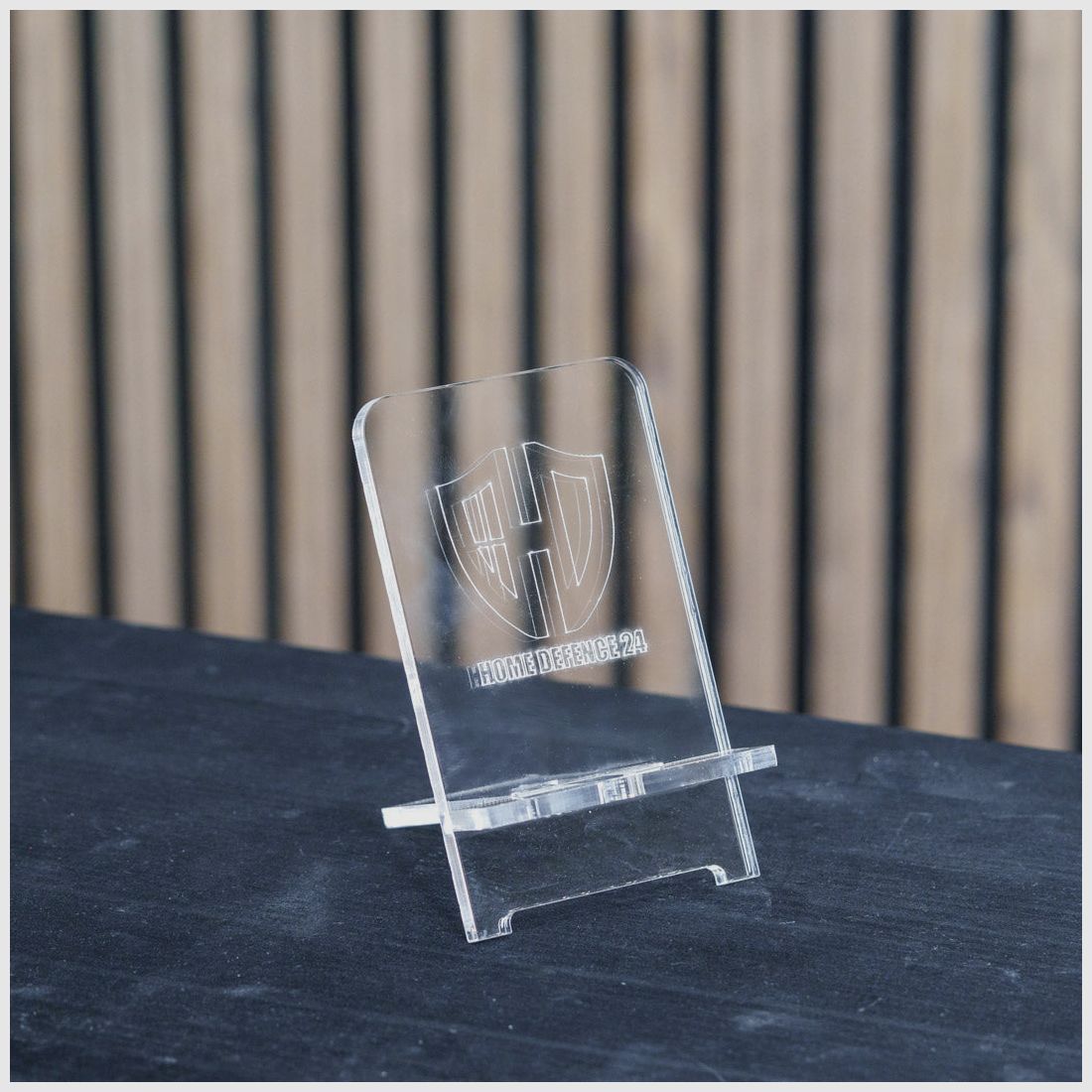 PLEXIGLAS® Phone Holder | Stylish Design with Laser Engraved Homedefence Logo