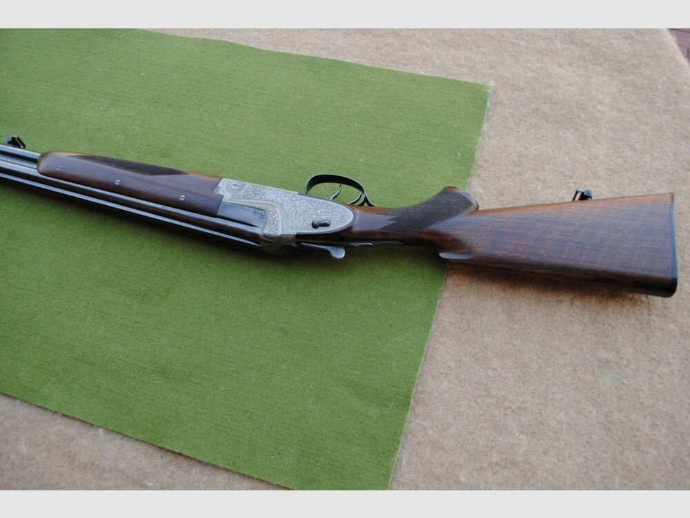 hand-engraved Merkel side lock double barrel shotgun, model 203E