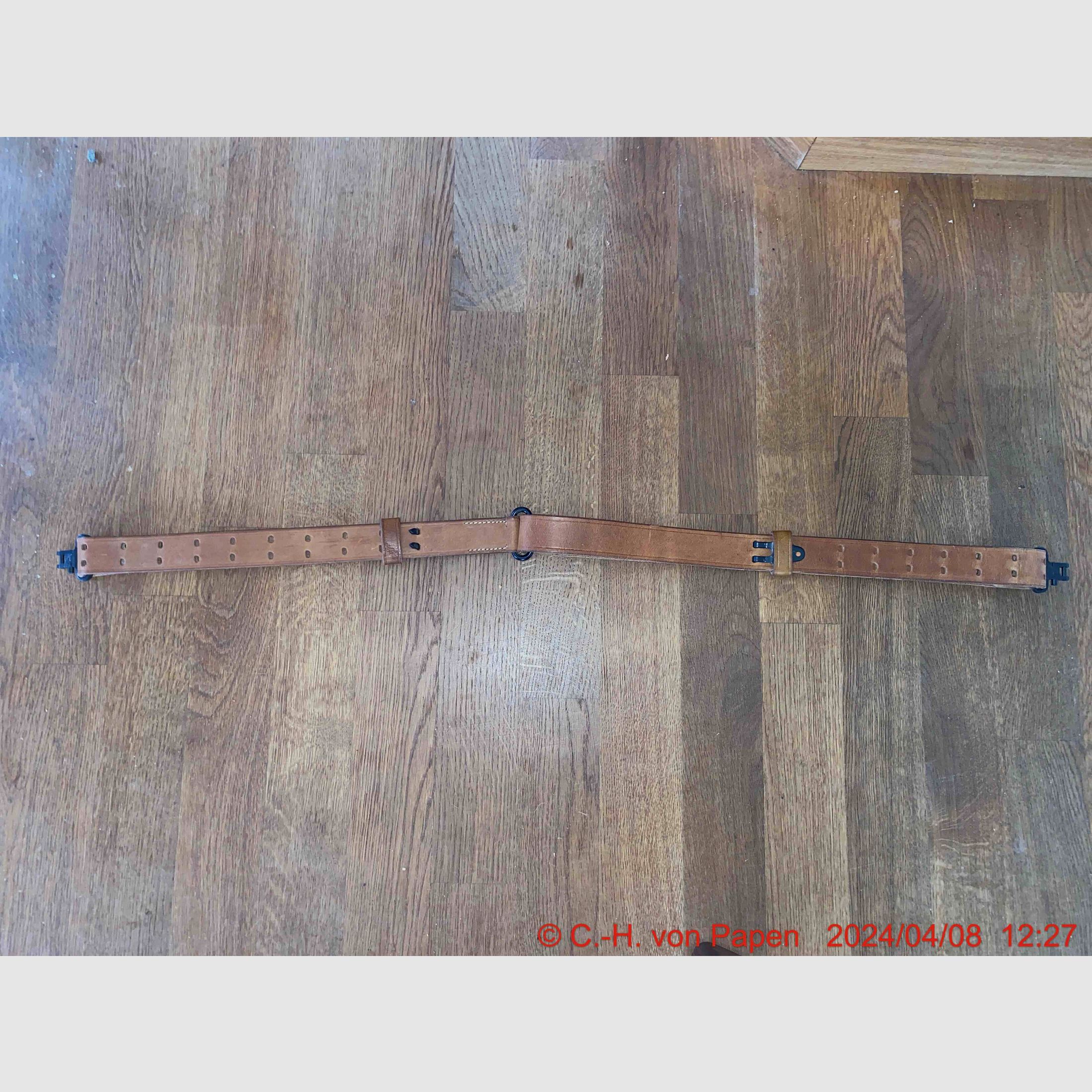 Rifle sling with strap buckle