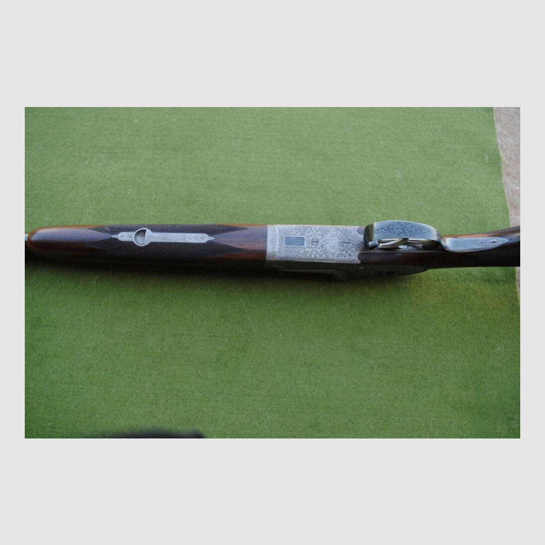 hand-engraved Merkel side lock double barrel shotgun, model 203E
