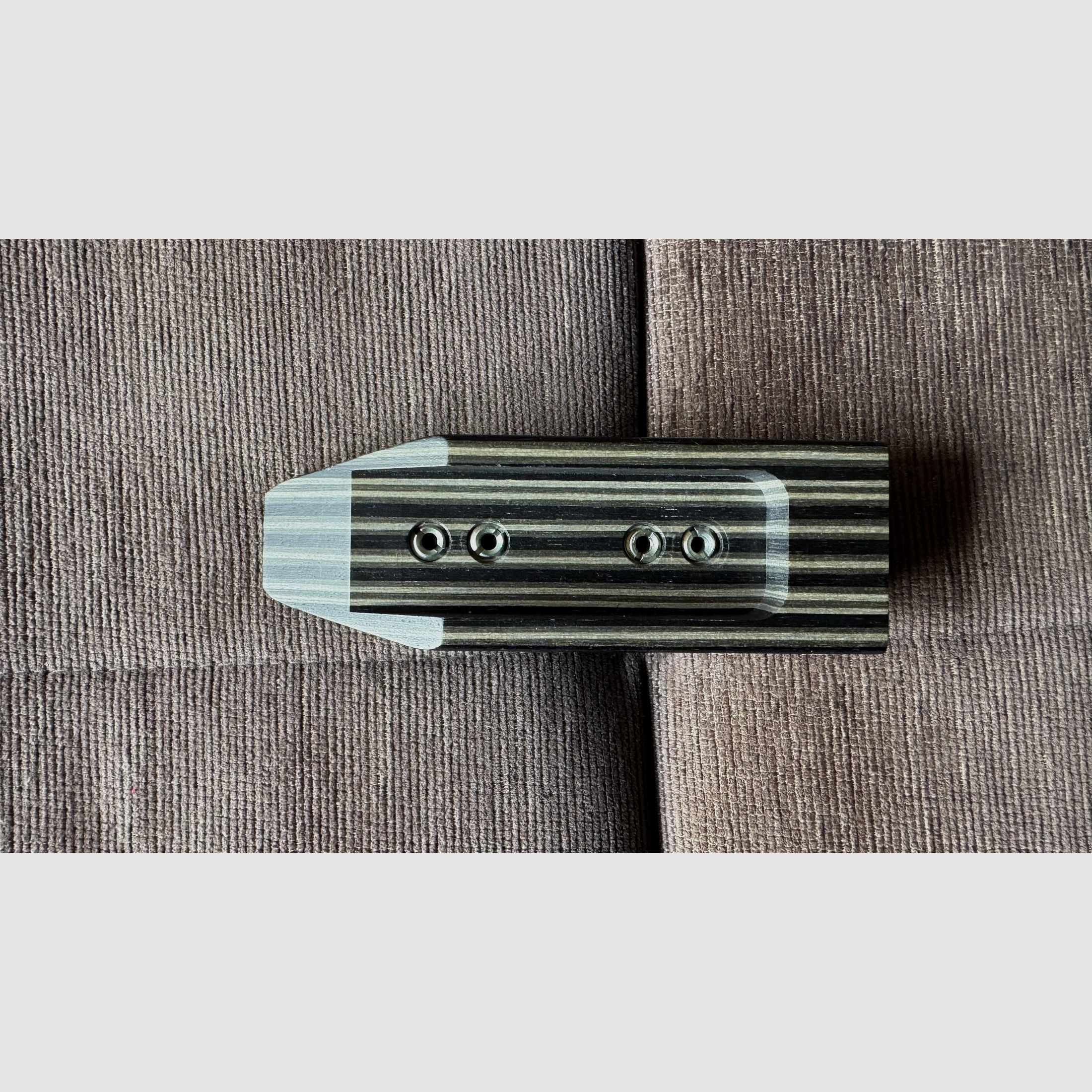 Feinwerkbau 700 cheek piece made of laminated wood.