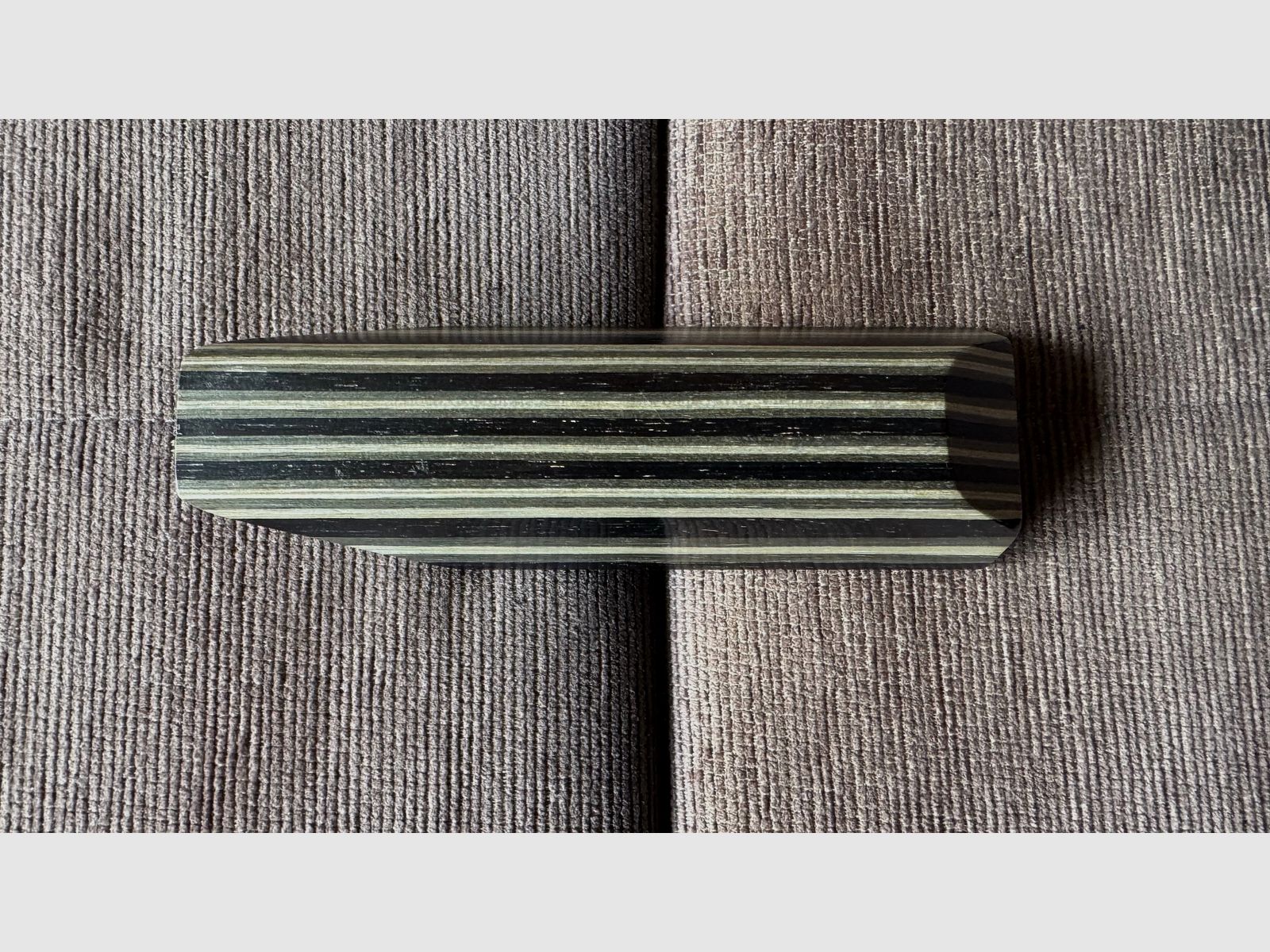 Feinwerkbau 700 cheek piece made of laminated wood.