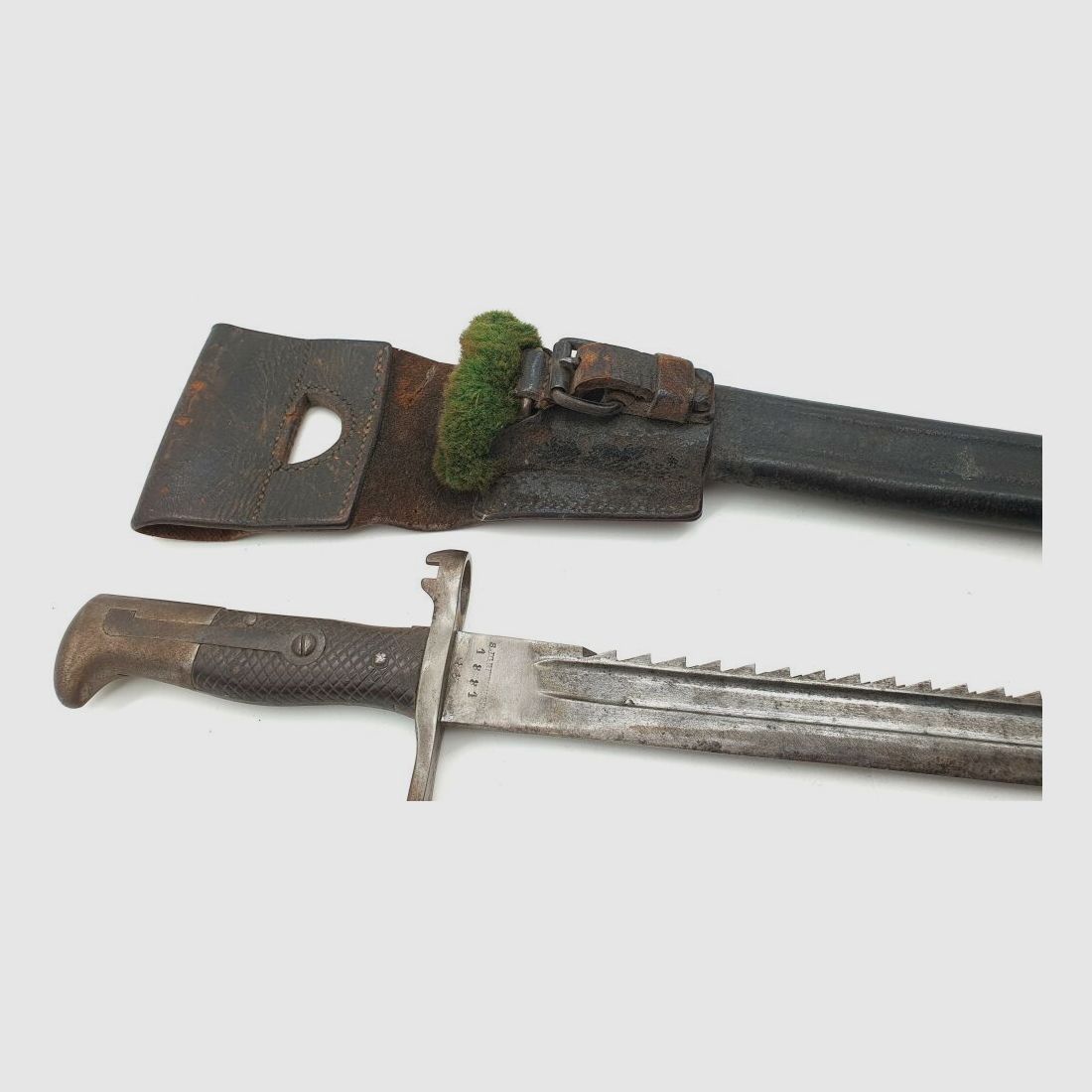 Vetterli original Vetterli bayonet with saw teeth and green fur on the scabbard