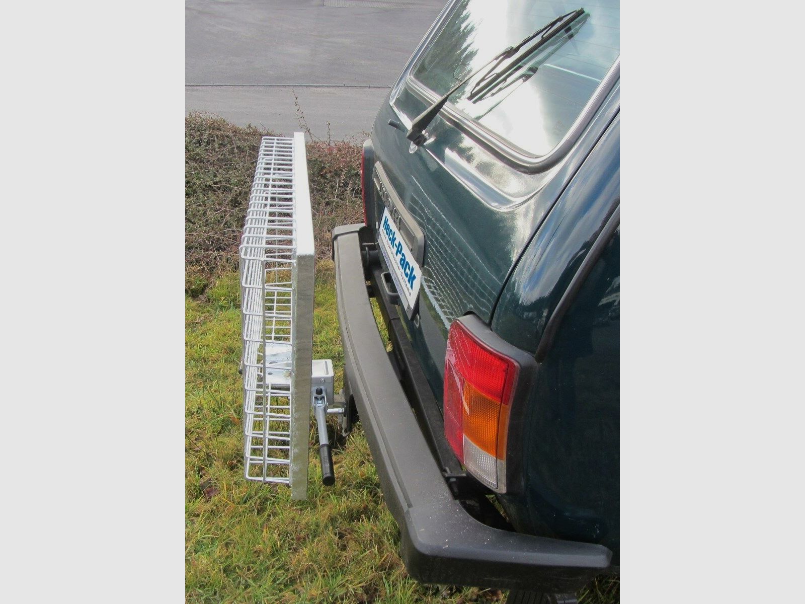 Heck-Pack Ein-und Aufklappvorrichtung