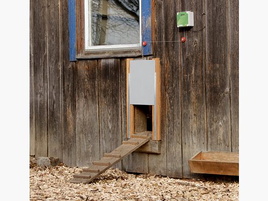 Porte à poules automatique avec coulisseau