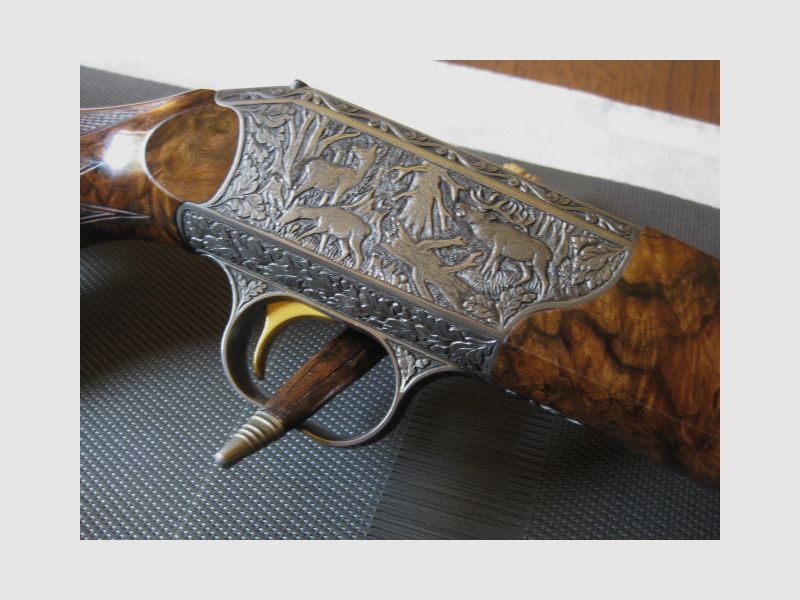 WORLDWIDE GUARANTEED UNIQUE COLLECTOR'S ITEM = Almost new "Custom STEEL SYSTEM completion" with HAND ENGRAVINGS for R93, with right-hand semi-weight stock custom-made and category-11 !! The system is still one WITHOUT serial number !! Including Blaser leather rifle sling!