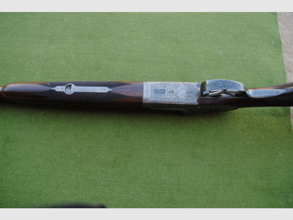 hand-engraved Merkel side lock double barrel shotgun, model 203E