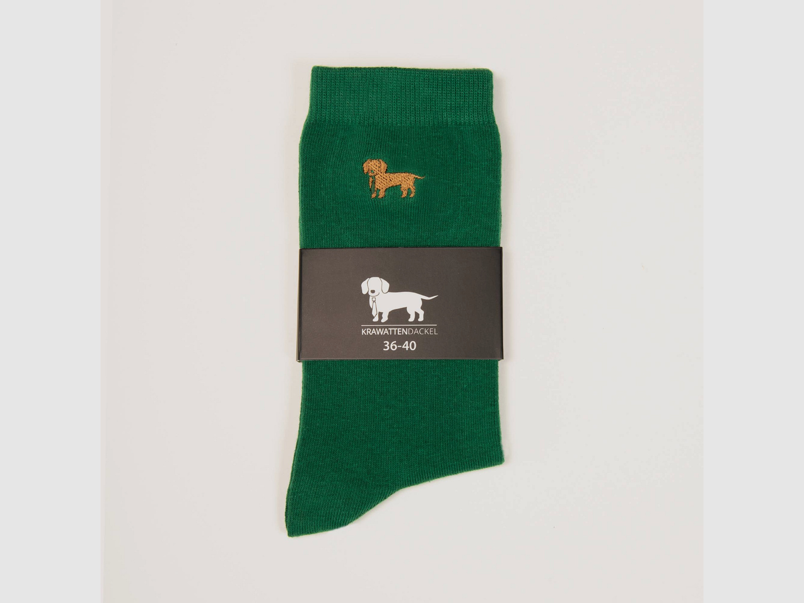 Grüne Socken mit gesticktem Dackelmotiv