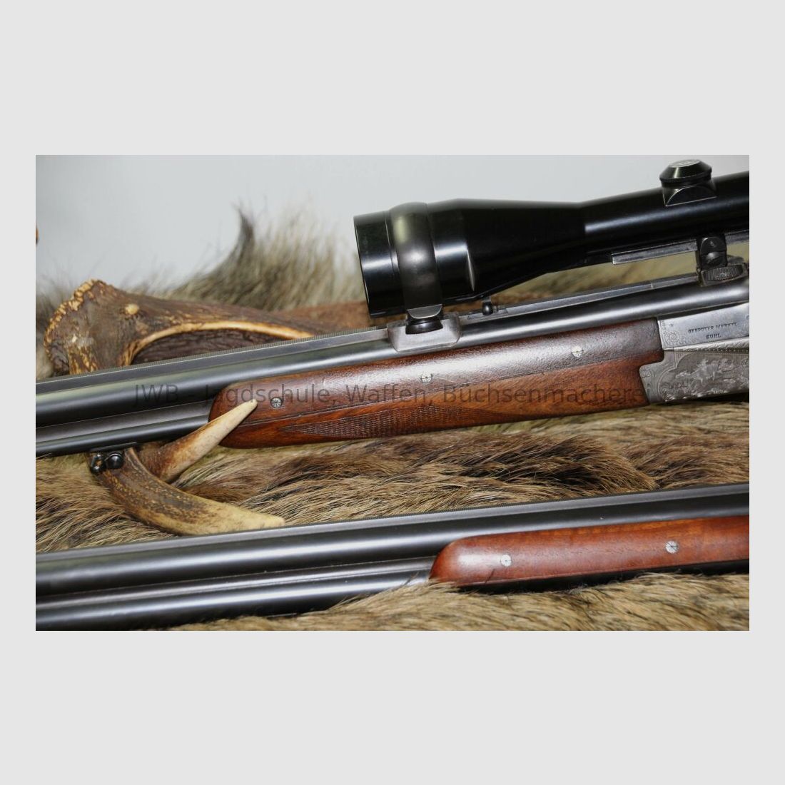 Merkel double-barreled shotgun with interchangeable double-barrel and variable sight 12/70; 7x57R