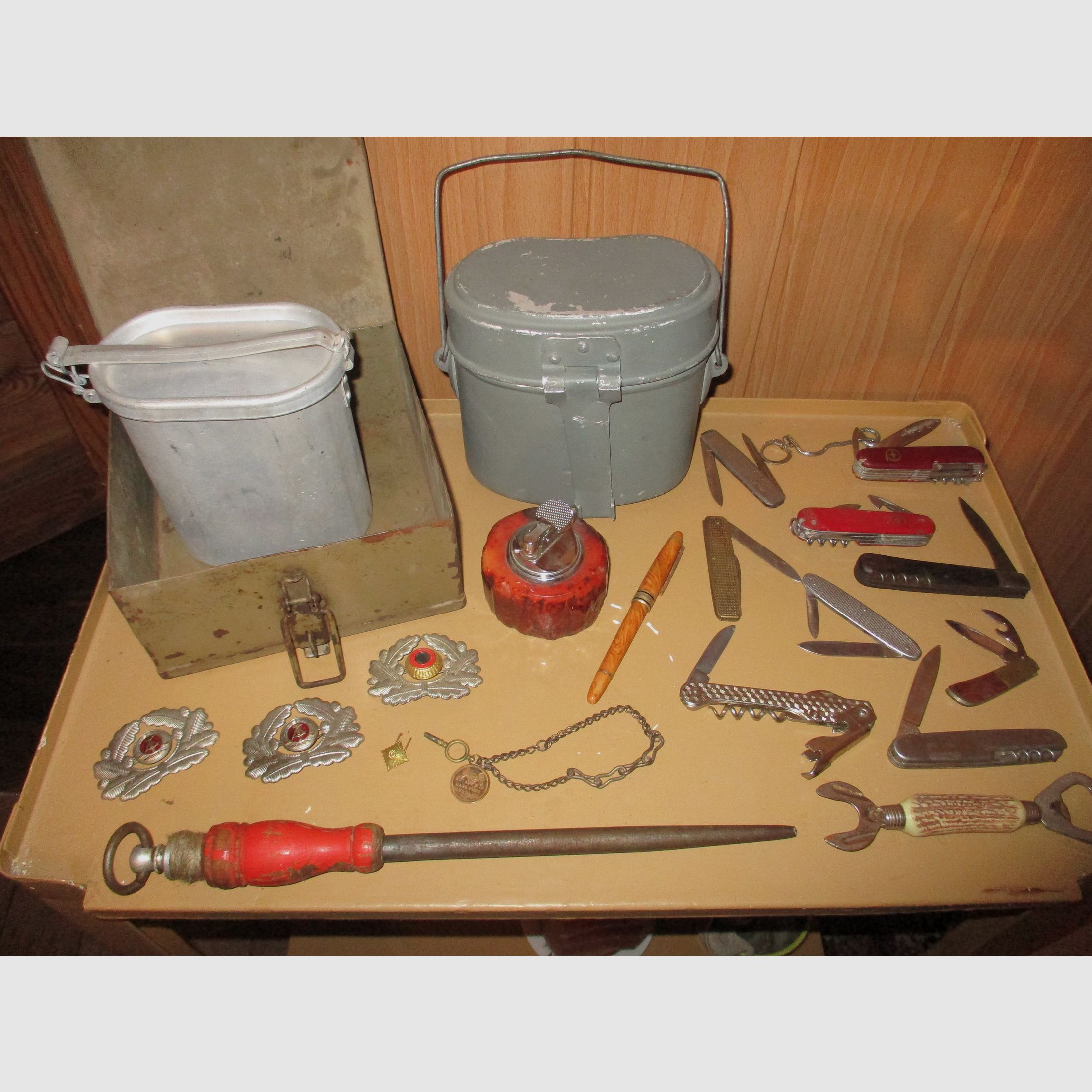 Swiss army knife, among other things, old metal ammunition box, medal on chain, among other things, military
