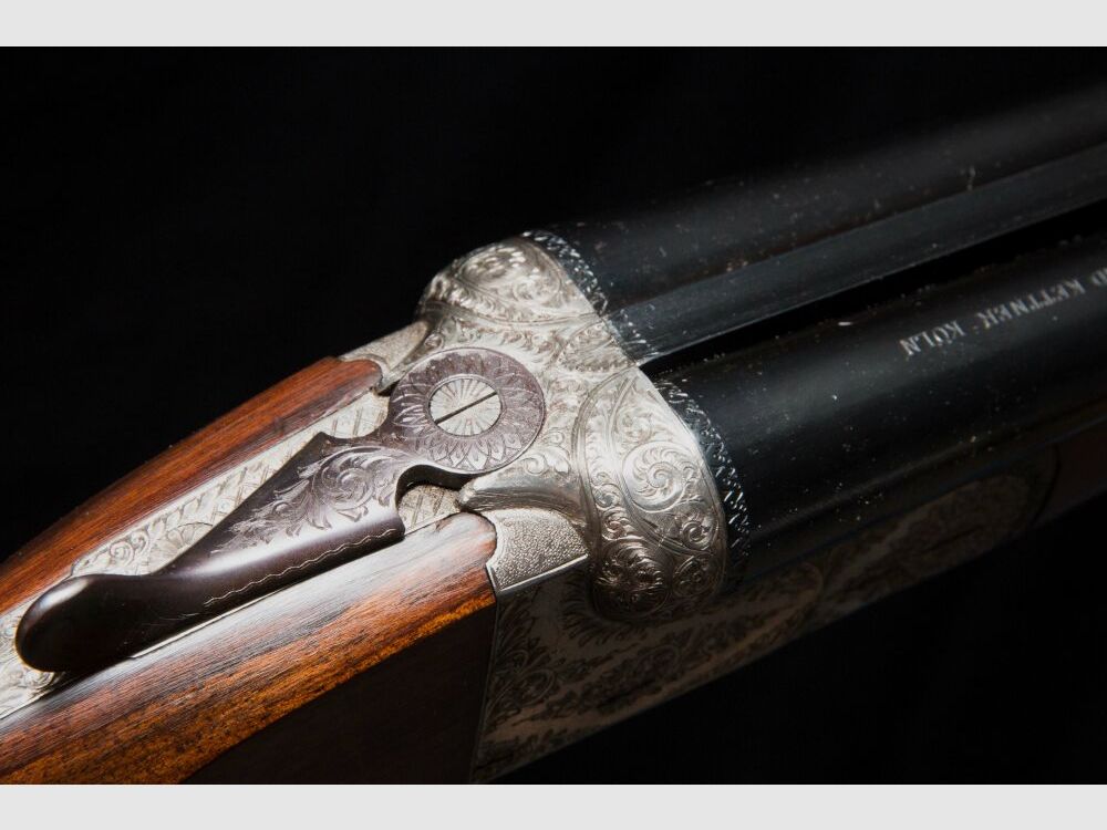elegante Doppelflinte mit umfassender Gravur