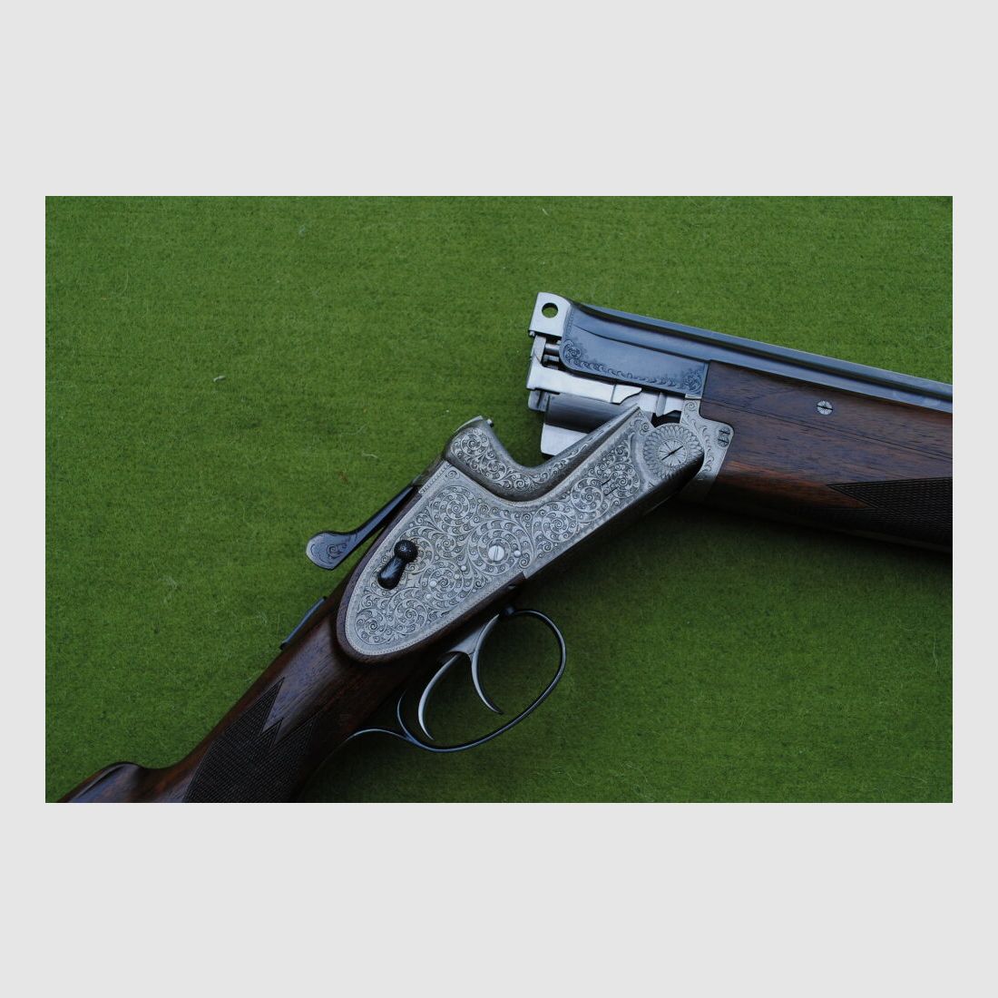 hand-engraved Merkel side lock double barrel shotgun, model 203E