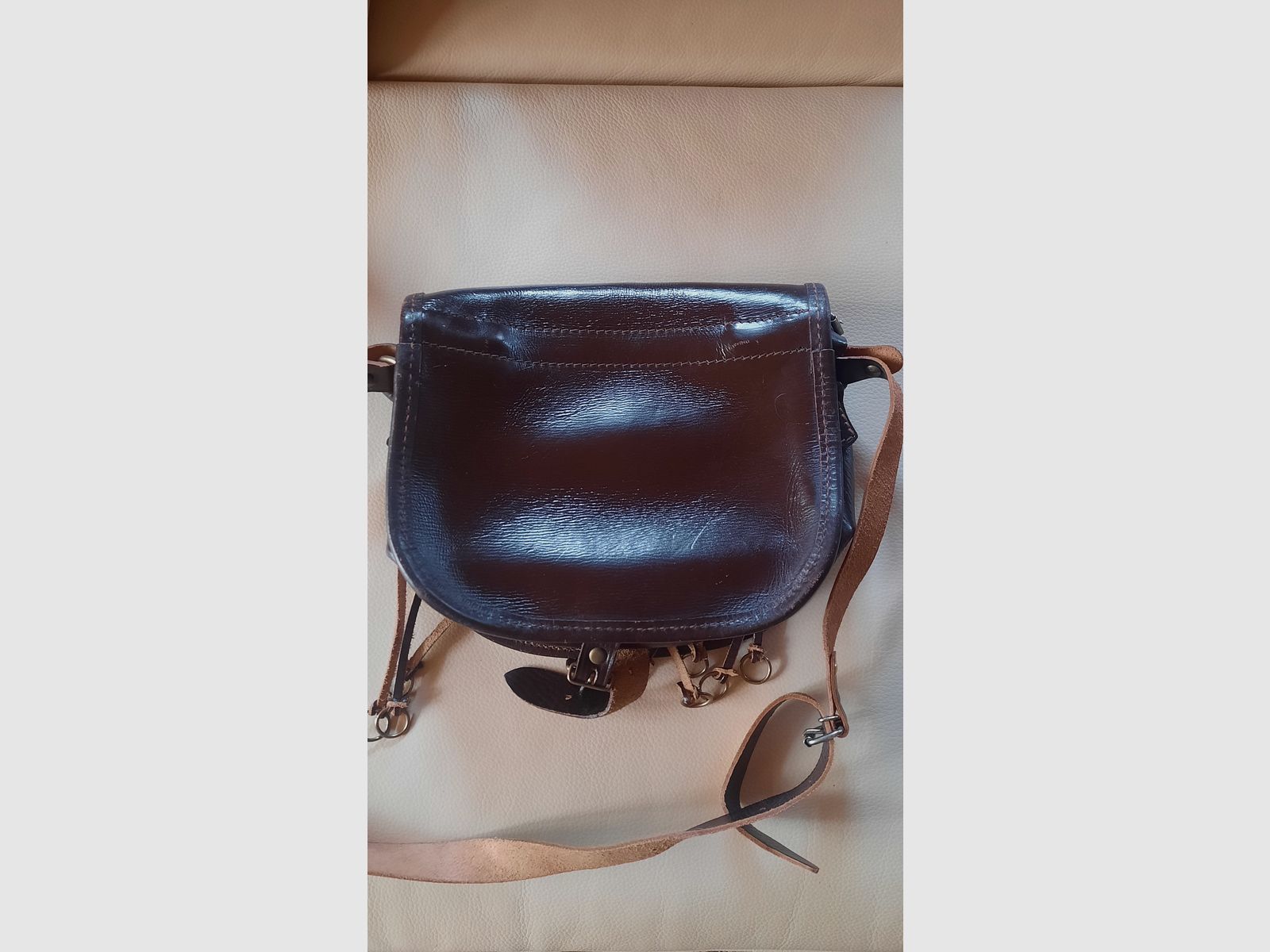 Lederset mit 2 Fernrohrköchern, einer Jagdtasche und einem Patronengurt
