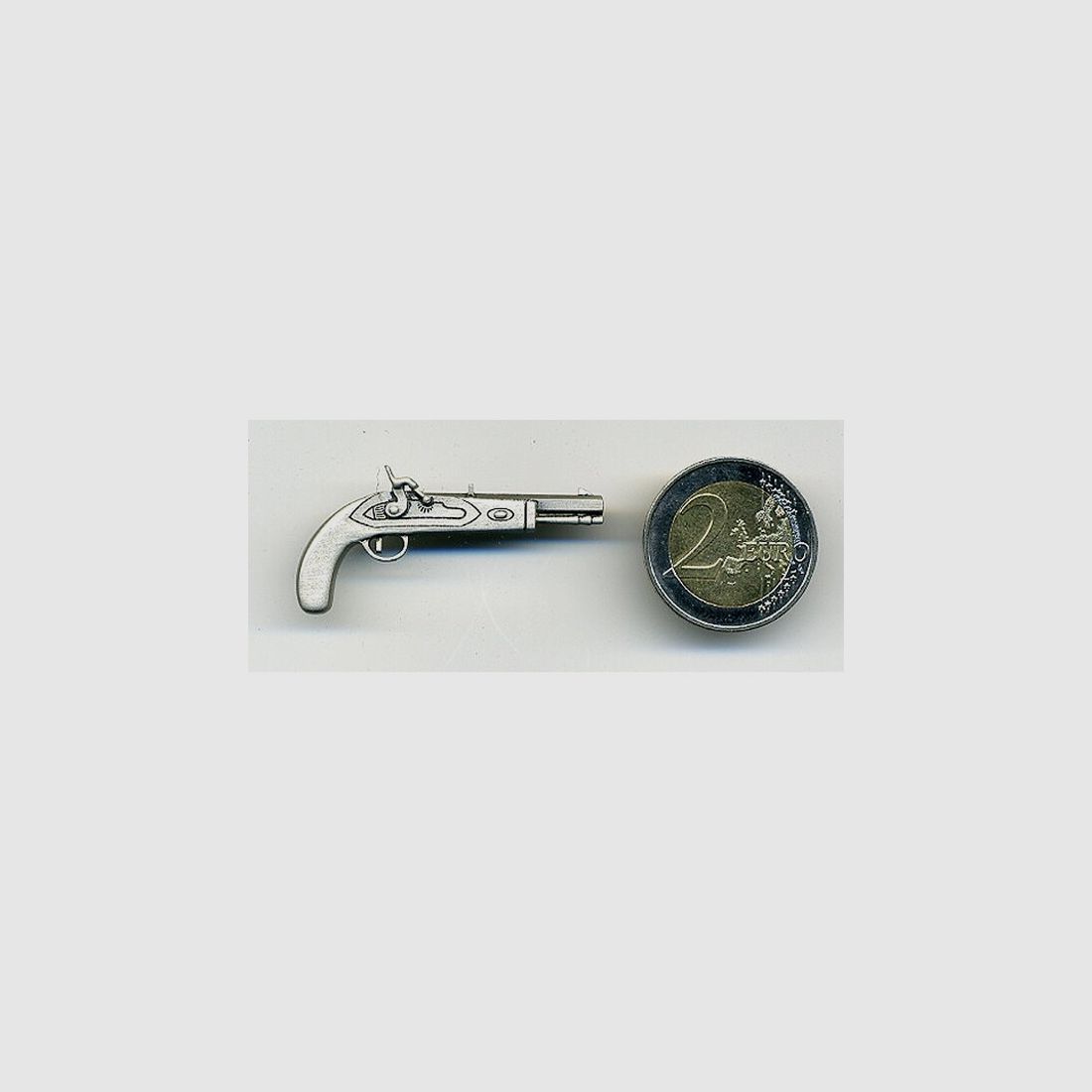 Perkussions-Pistole als Metall-Anstecker