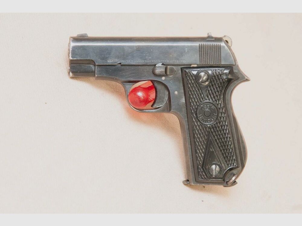 Unique inkl. Holster und Ersatzmagazin