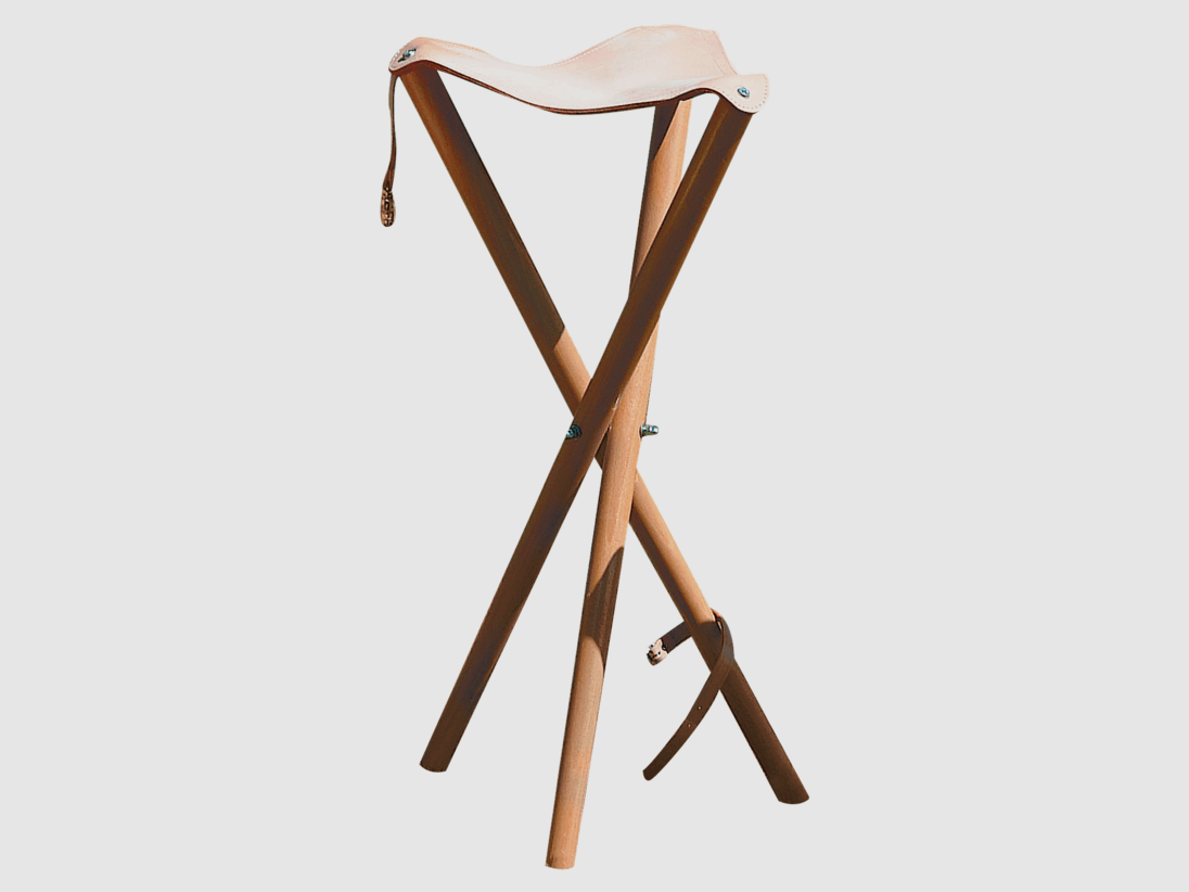 Three-legged stool with leather seat surface