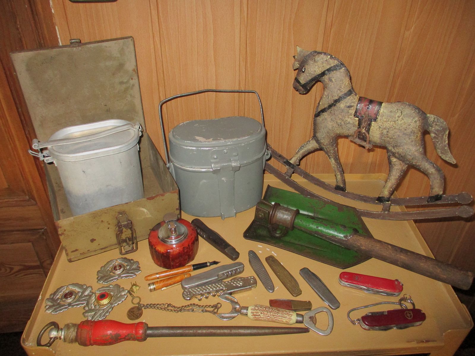 Swiss army knife, among other things, old metal ammunition box, medal on chain, among other things, military