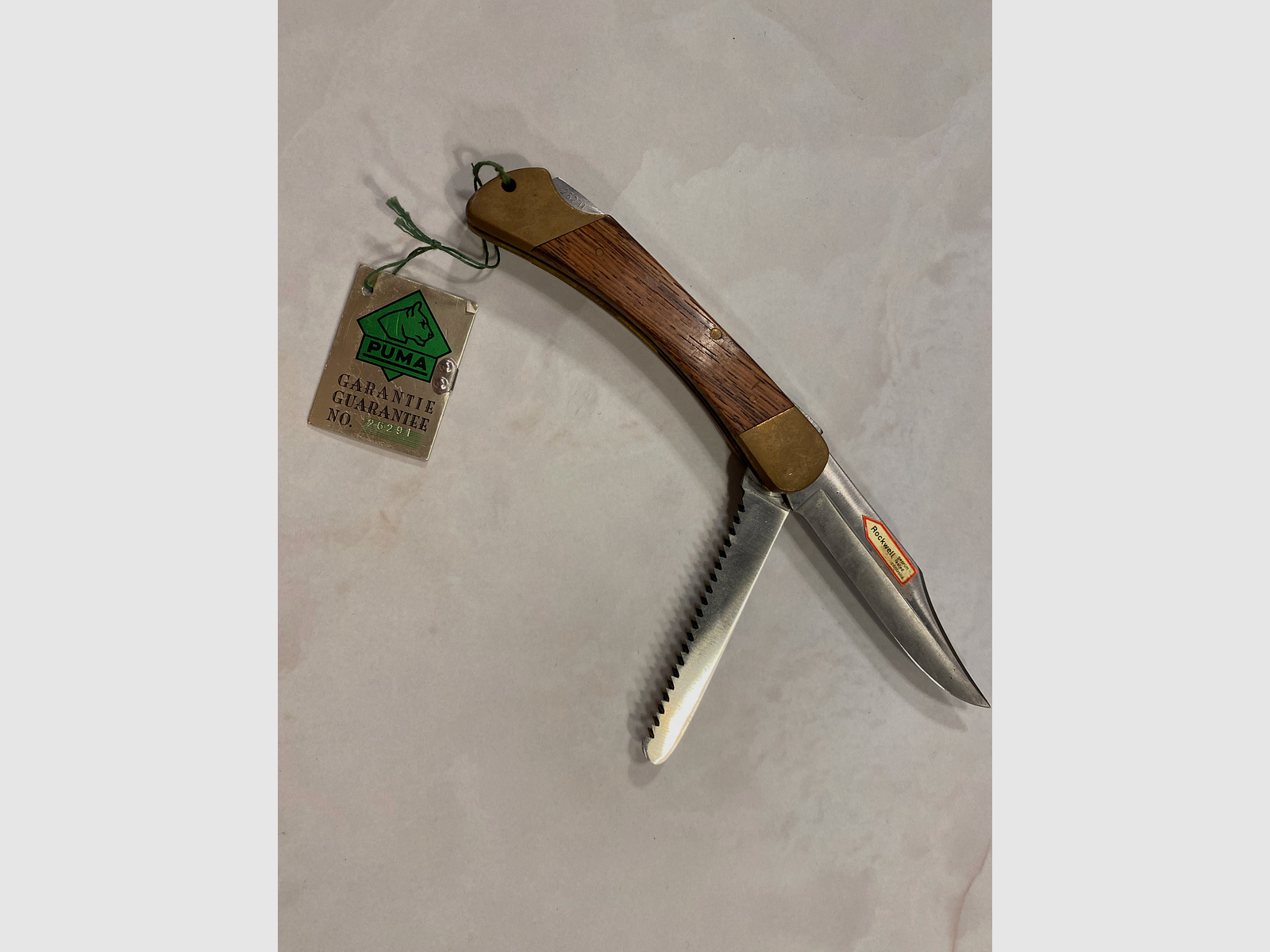 Couteau de chasse PUMA Solingen – 2 pièces (lame + scie) – poignée en bois – avec étiquette de garantie