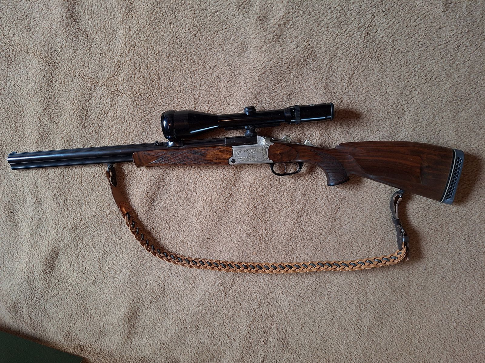 Escopeta combinada de Blaser, modelo BBF 700/88, calibre 12/70 cañón de escopeta, .30-06 cañón de rifle, visor Schmidt & Bender 2,5 - 10x