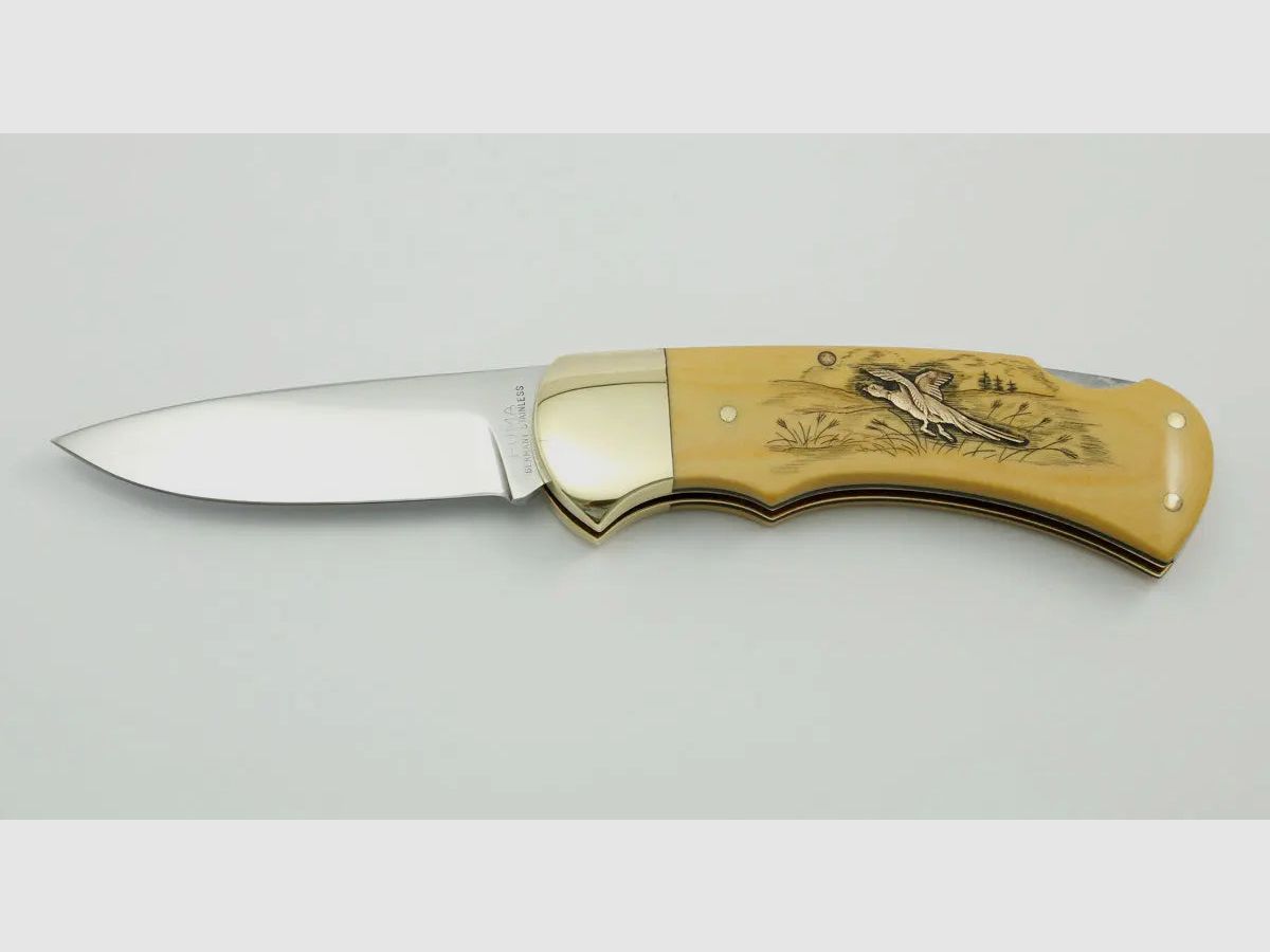 (Rarities) Puma 4-Star 715 with brass inlays duck and pheasant, warranty card, 1983