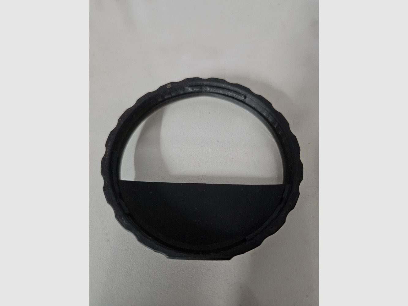Objective lens aperture sound suppressor anti-reflection
