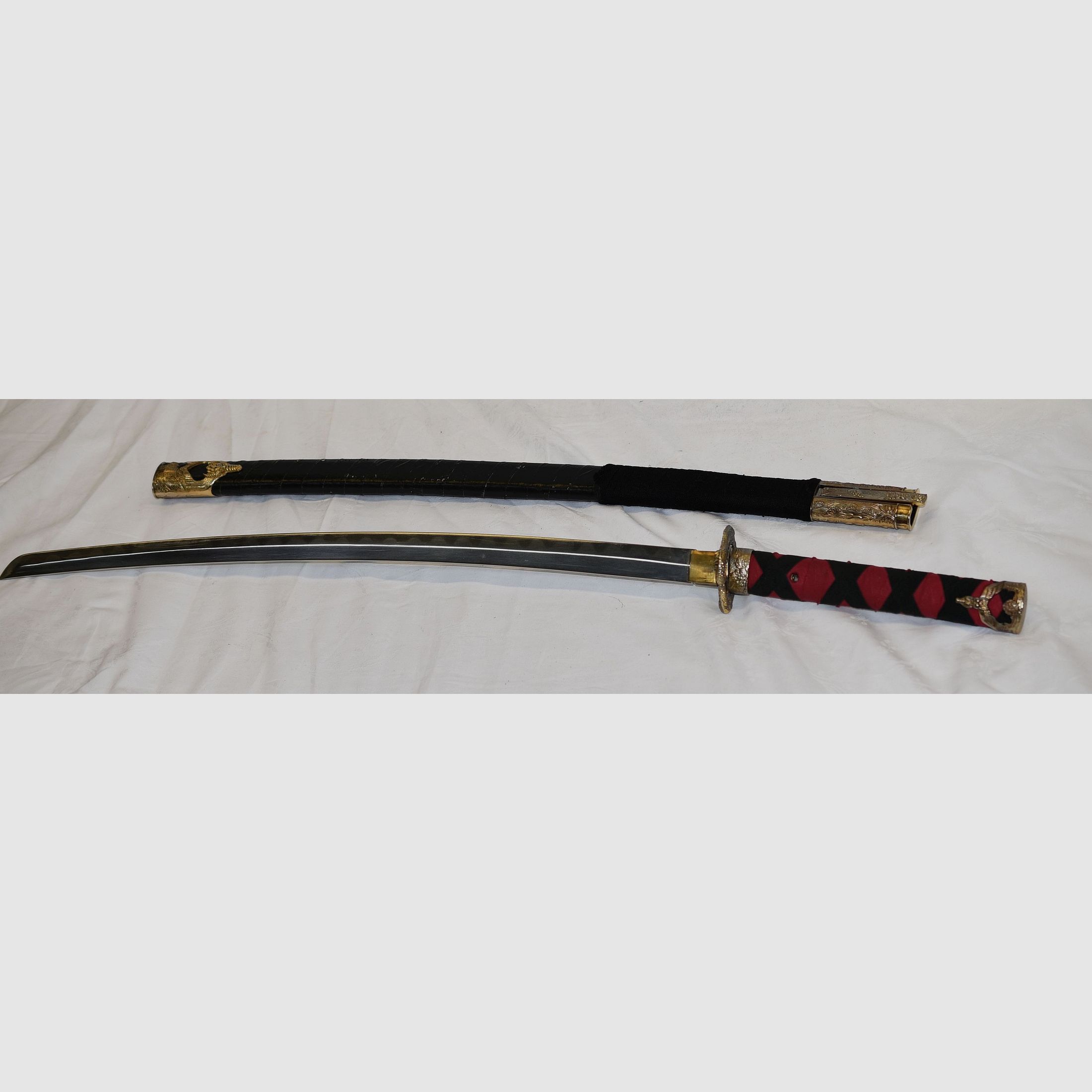 Japans zwaard, Samurai, Katana, Wakizashi, met Menuki op de greep