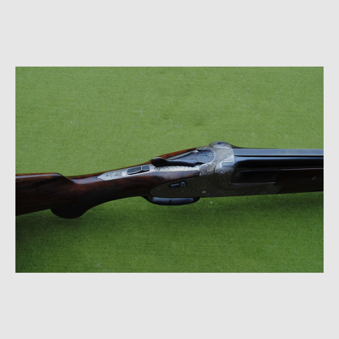 hand-engraved Merkel side lock double barrel shotgun, model 203E