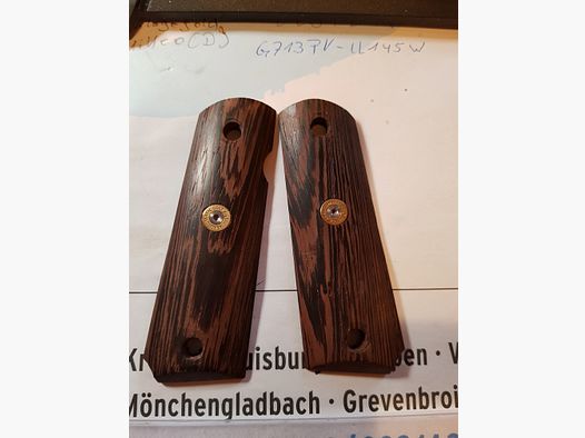 Griffschalen der Colt 1911 oder ME Sport 1911, siehe Bild. 