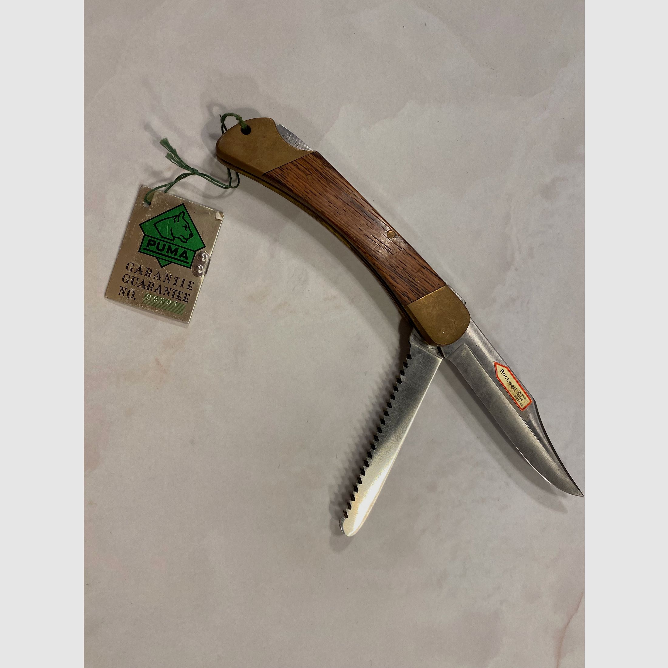 Couteau de chasse PUMA Solingen – 2 pièces (lame + scie) – poignée en bois – avec étiquette de garantie