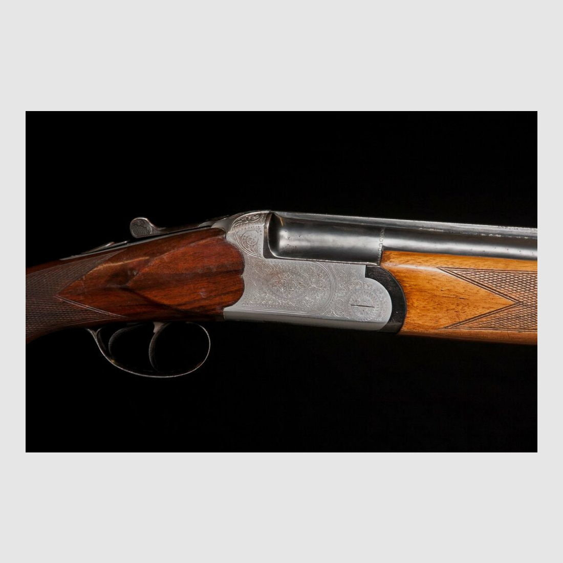Double-barreled shotgun with ejector