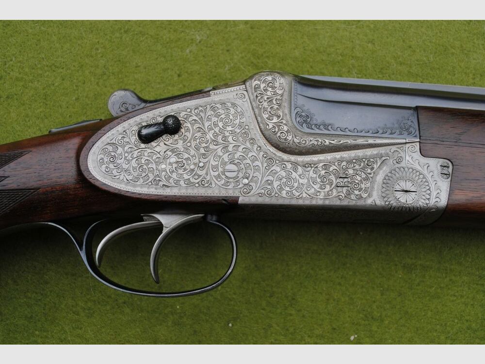 hand-engraved Merkel side lock double barrel shotgun, model 203E