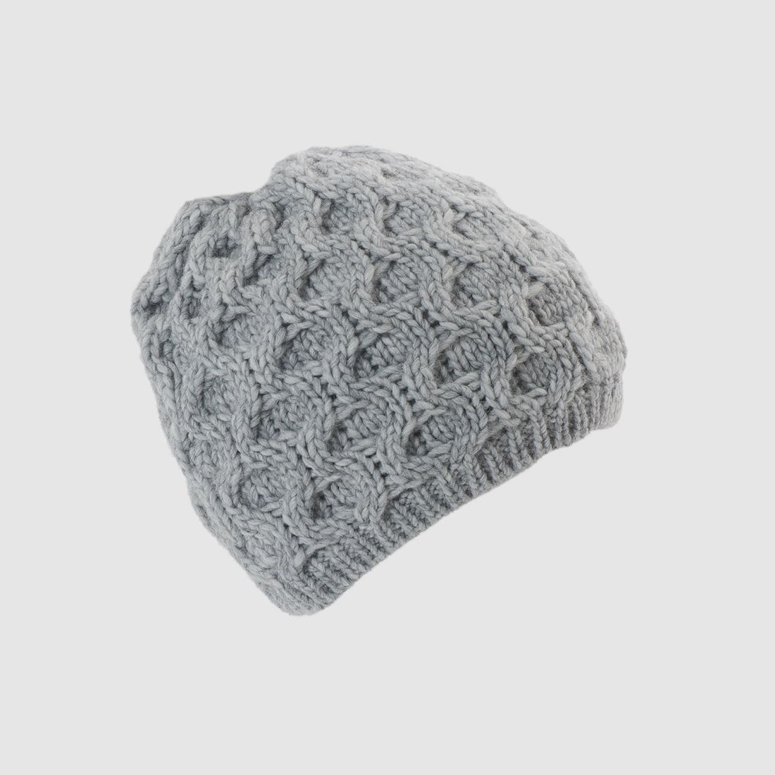 Cappello lavorato a maglia con pompon in pelliccia vera e motivo a nido d'ape