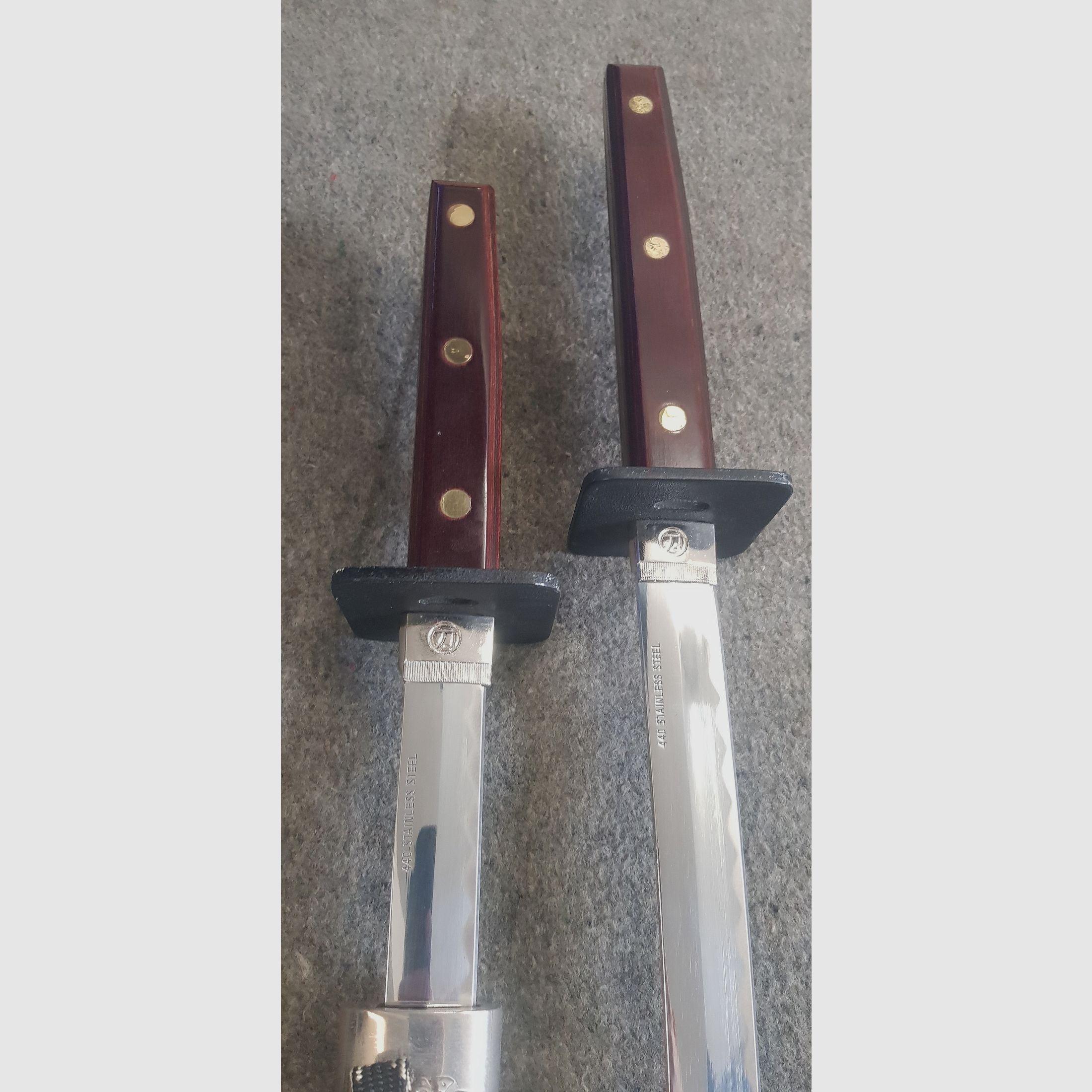 Collection of knives swords sabers ninja katanas