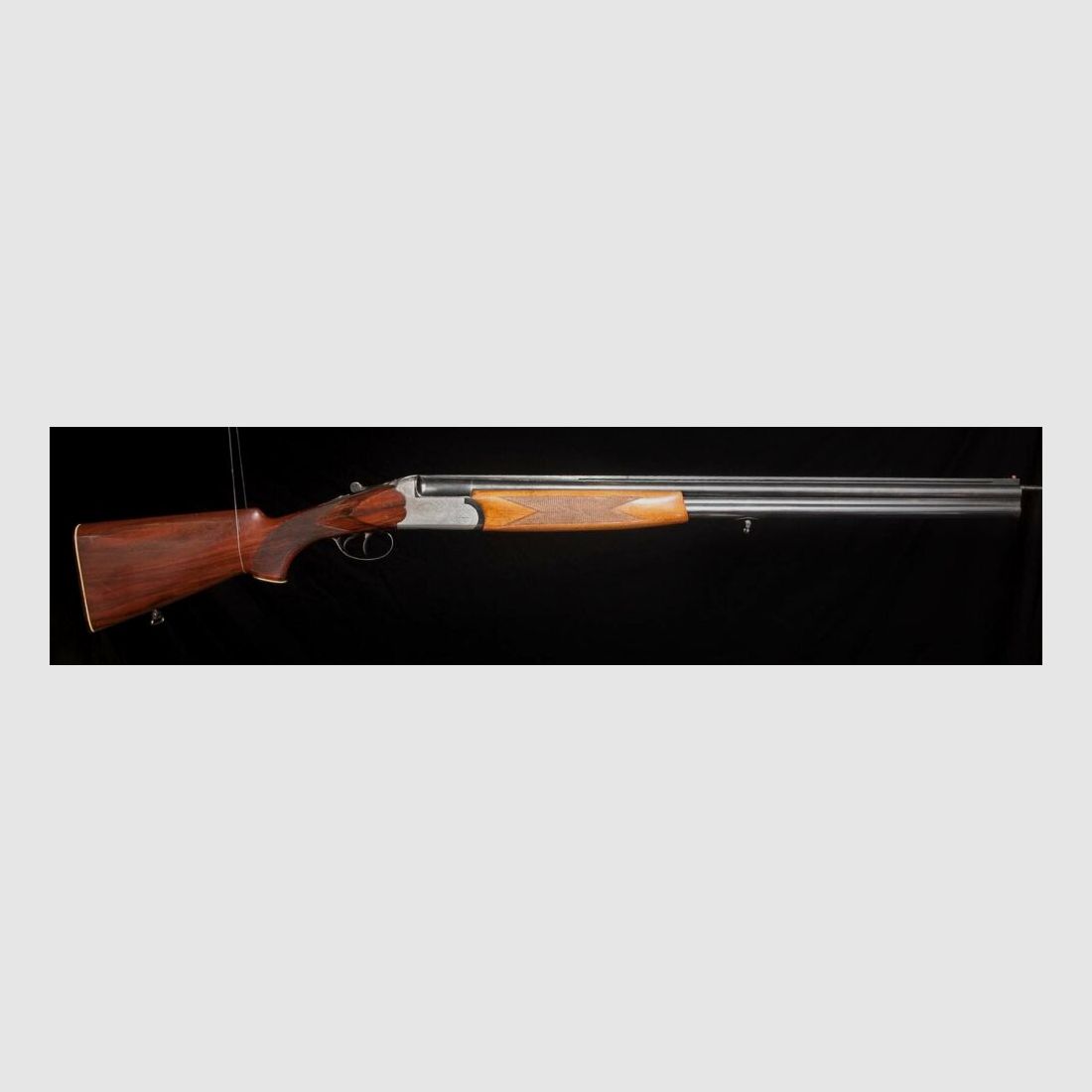 Double-barreled shotgun with ejector