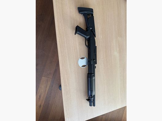 Begadi Sport shotgun with cartridges