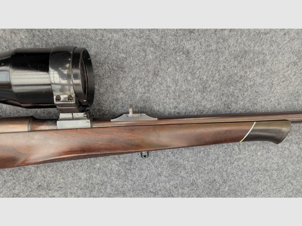 Mauser Mod 98 with animal engraving and stalking safety