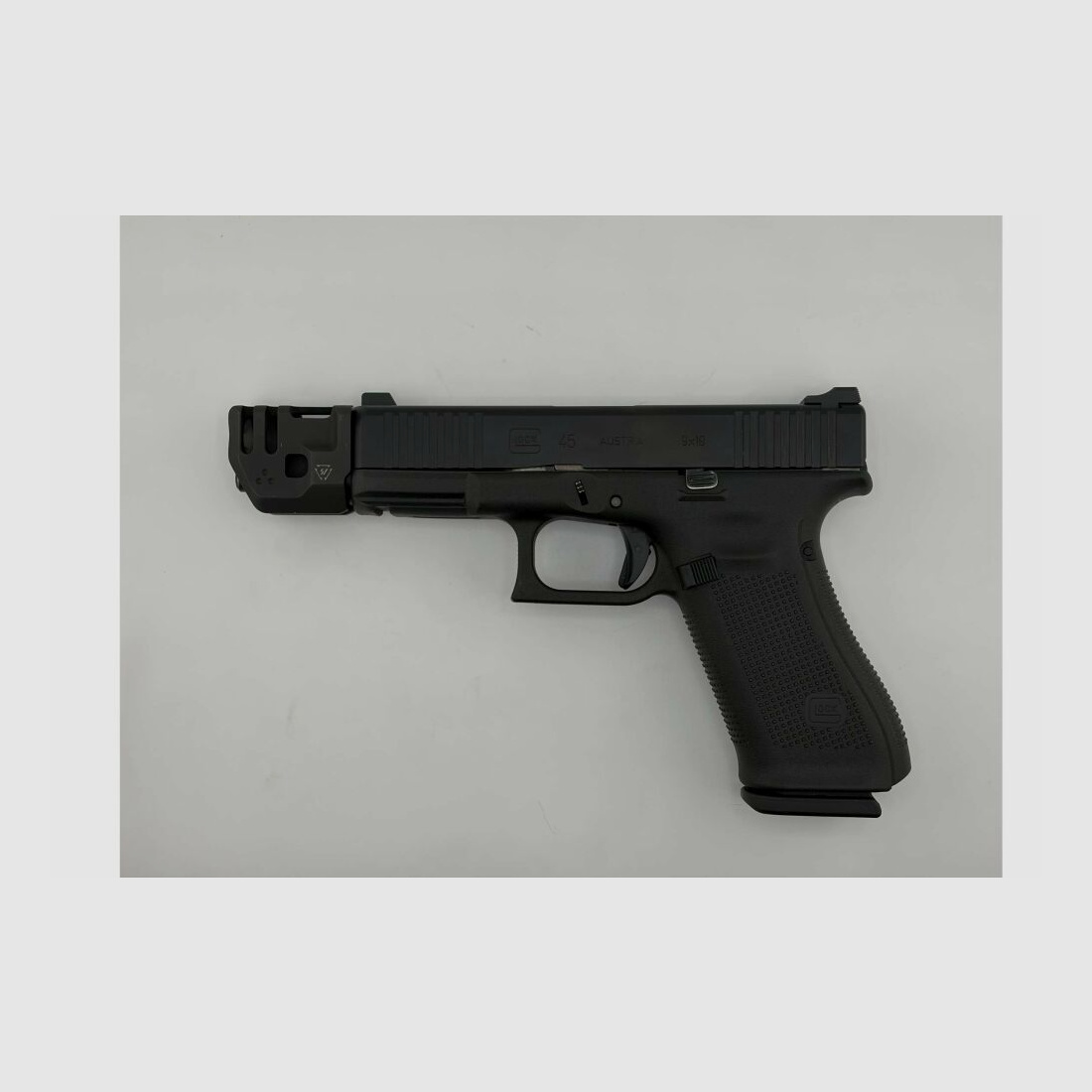 Glock 45 in 9x19 with removable Massdriver compensator from Strike Industries