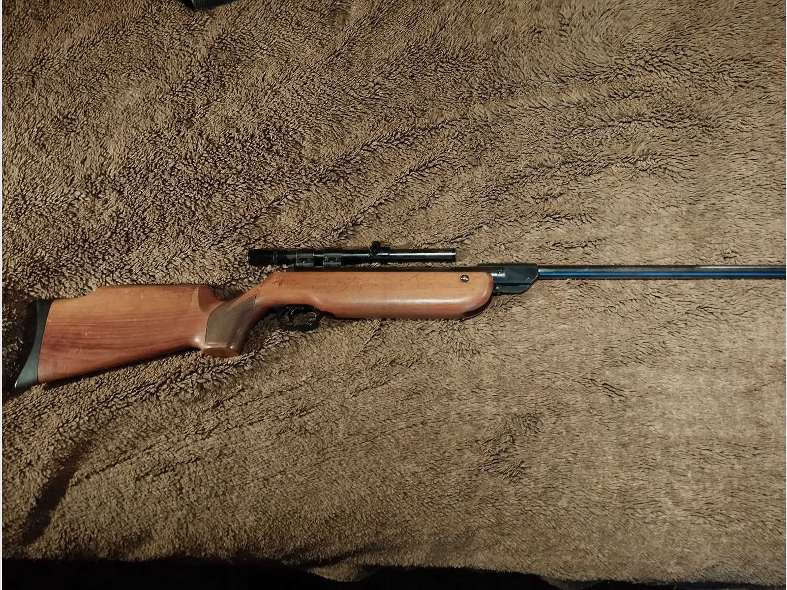 very well-preserved air rifle cal 4.5 mm with solid wooden stock and scope