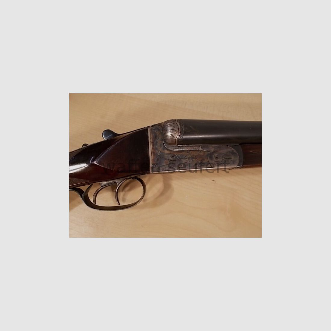 Forest double-barreled shotgun colored and engraved
