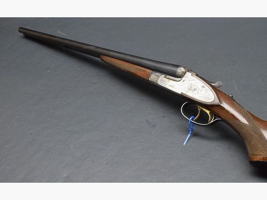 Side lock double barrel shotgun with color hardening