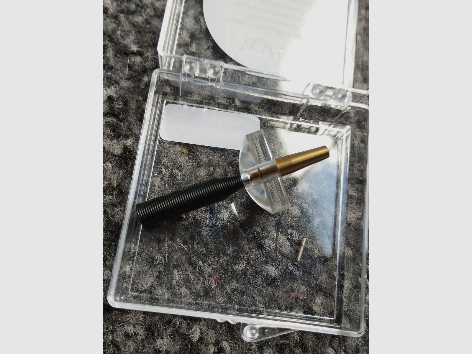Unused bullet hole tester with magnifying glass