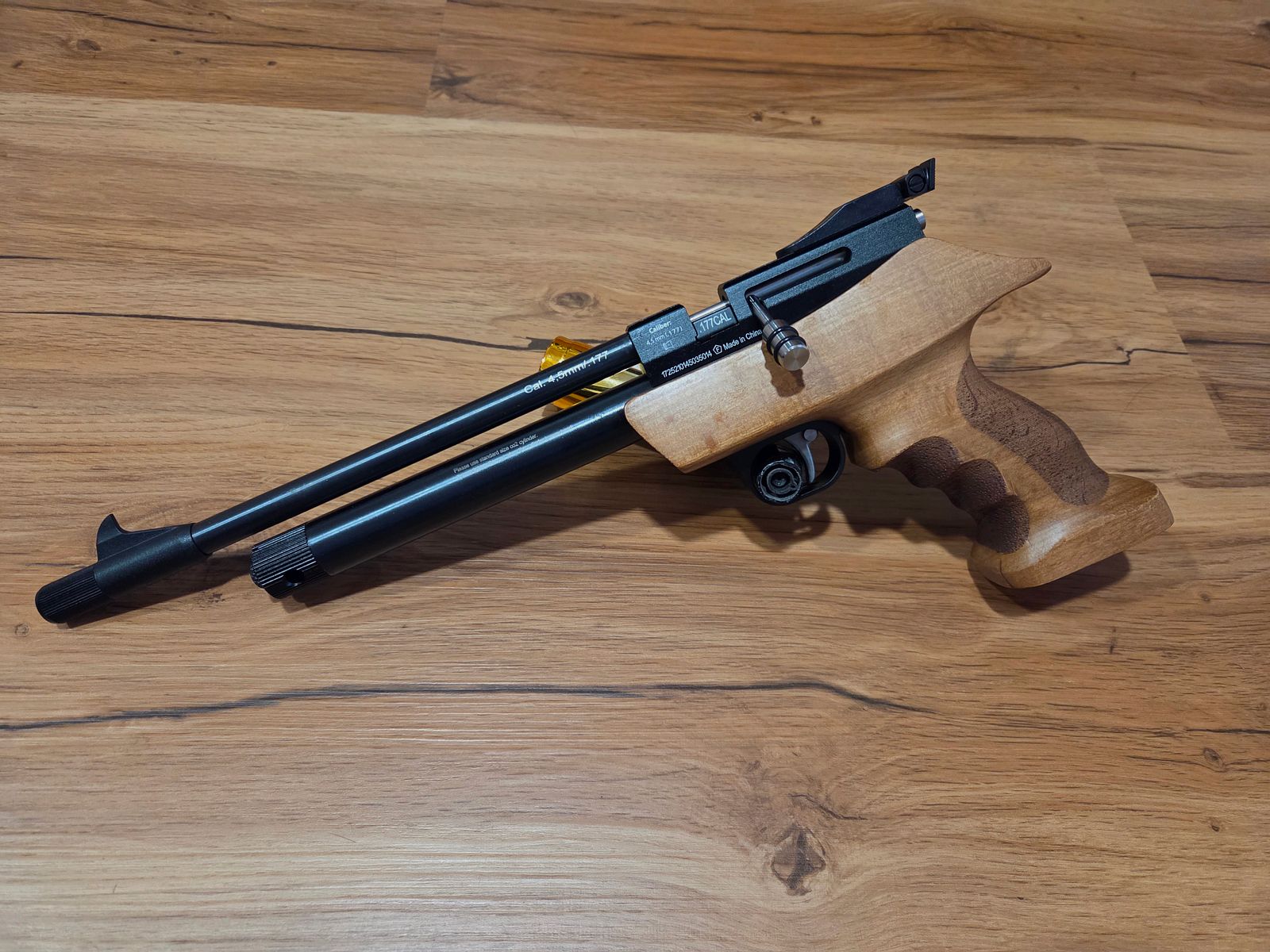 Diana Chaser with wooden handle and a pack of diabolos